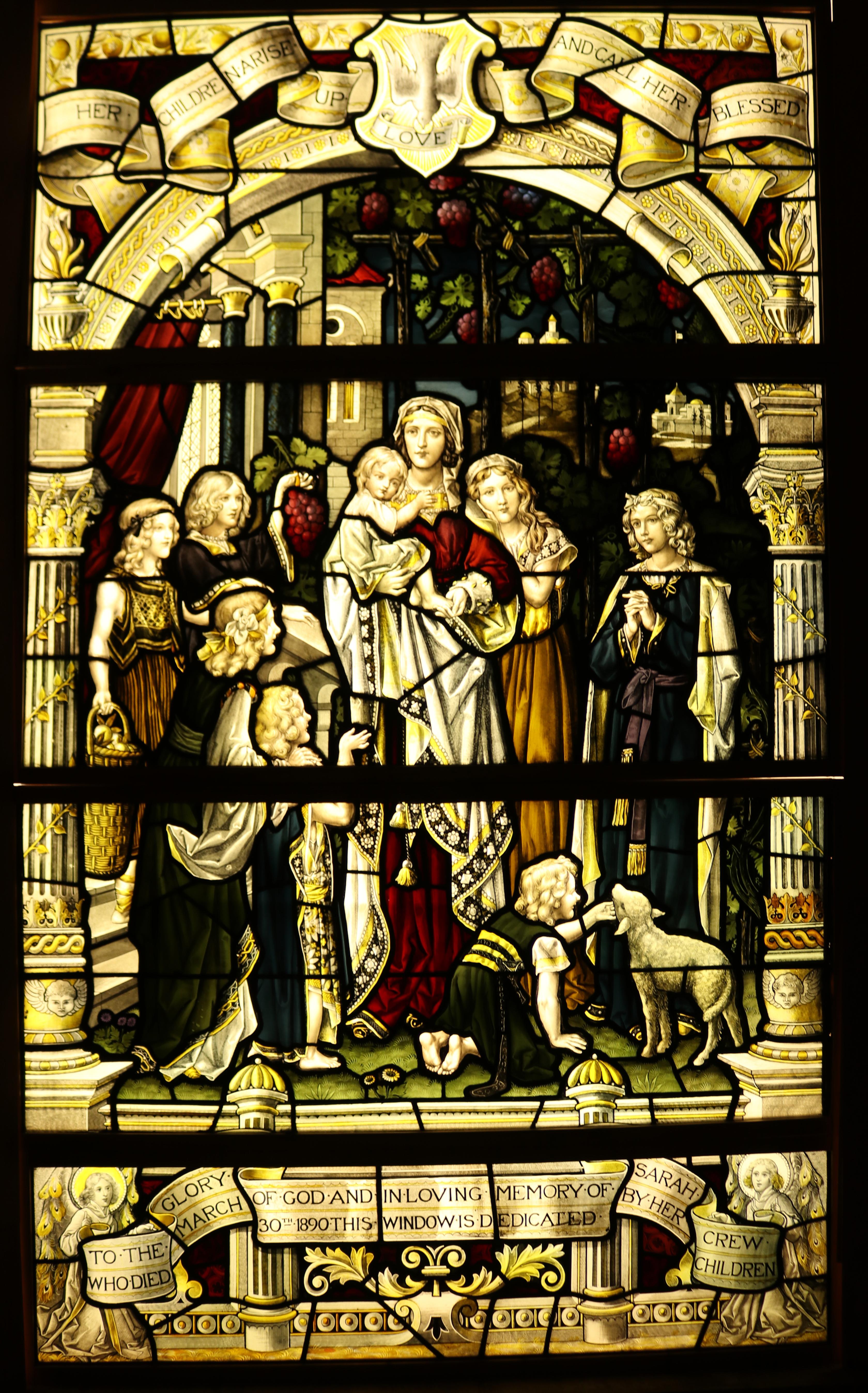 Signed; Cox Sons Buckley and Co, London 1900.

Inscription; 'Her children arise up love and call her blessed, to the glory of god and in loving memory of Sarah Crew who died March 30th 1890 this window is dedicated by her children.'

A stained