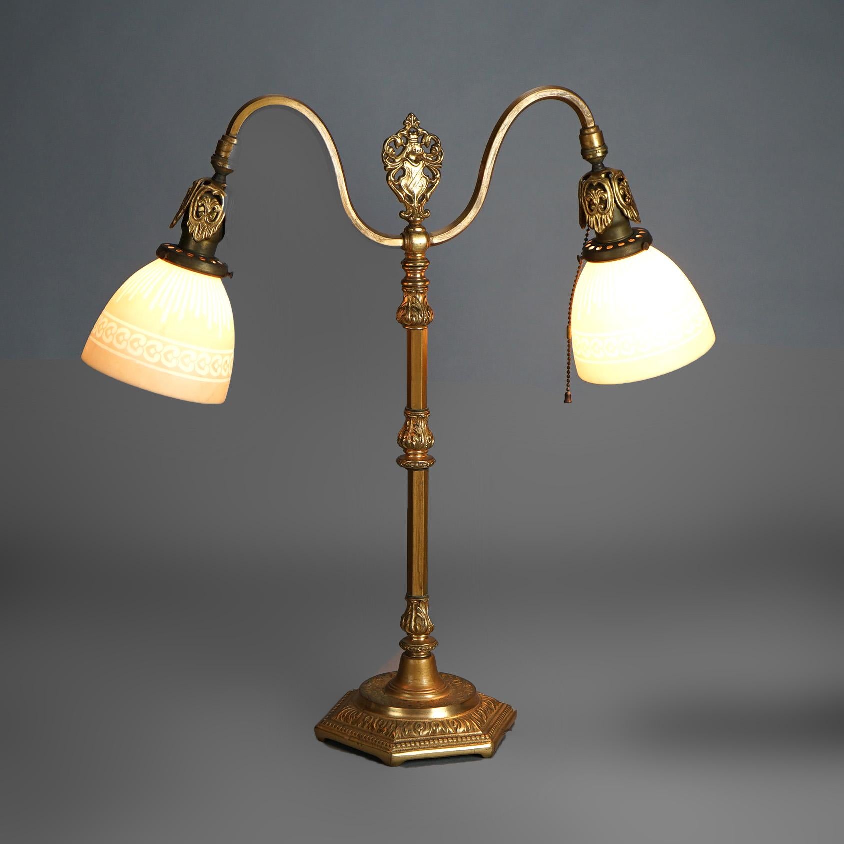 Antique Rembrandt Two-Light Foliate Embossed Brass Table Lamp with Art Glass Shades Circa 1920

Measures- 23''H x 22''W x 7''D