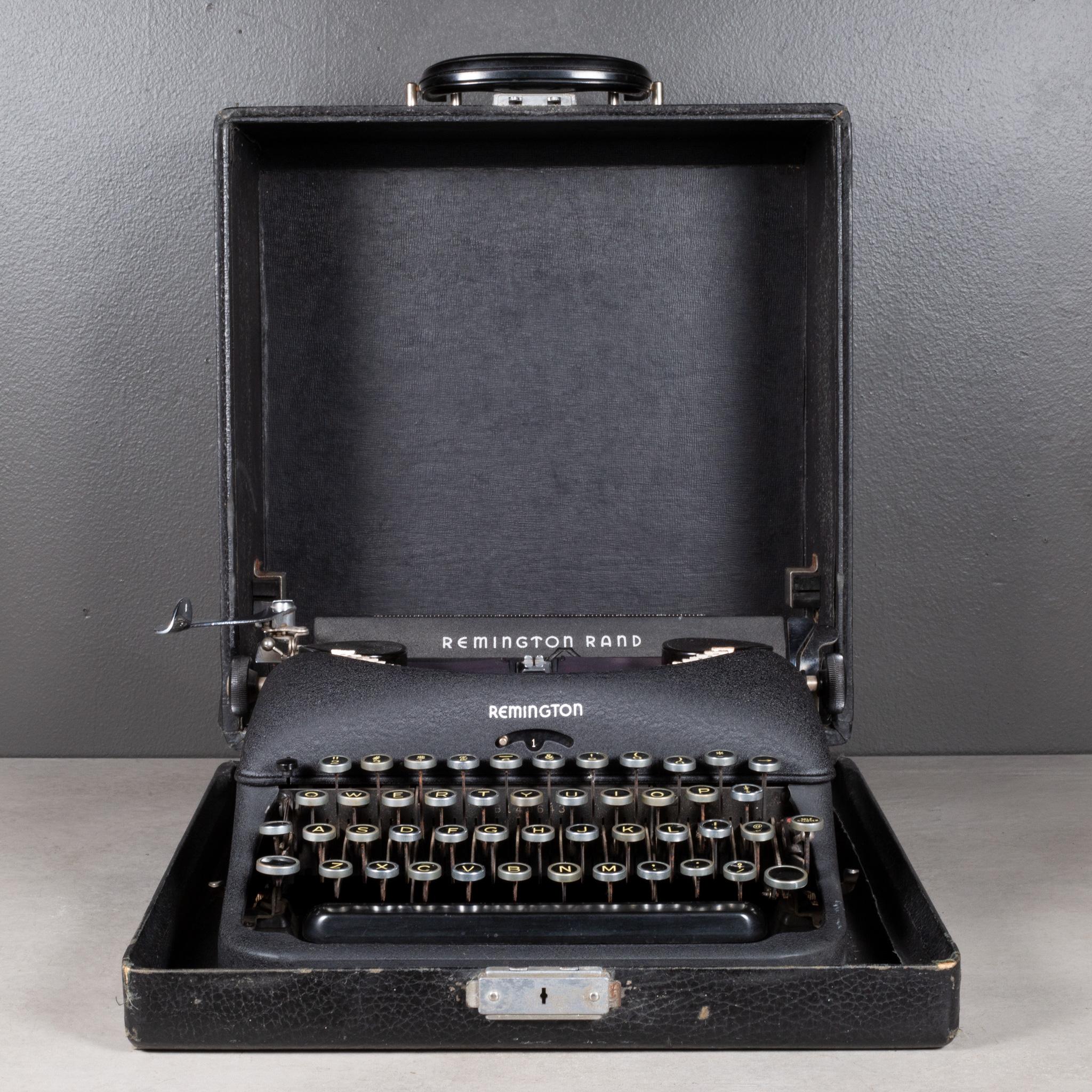 ABOUT

An original Remington Rand Deluxe Model 5 Typewriter with black, crinkle finish and original case. The keys are black with gold letters. This typewriter is very clean and works very well. It has smooth typing and the carriage advances and