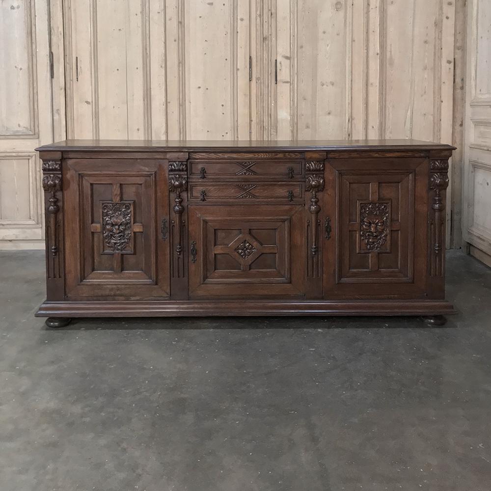 Antique Renaissance buffet was hand carved with the likeness of Bacchus, the Roman God of mirth, frivolity and wine. Perfect for your bar, entertainment room with a big flat panel TV on top, or anywhere a little whimsical effect is desirable.