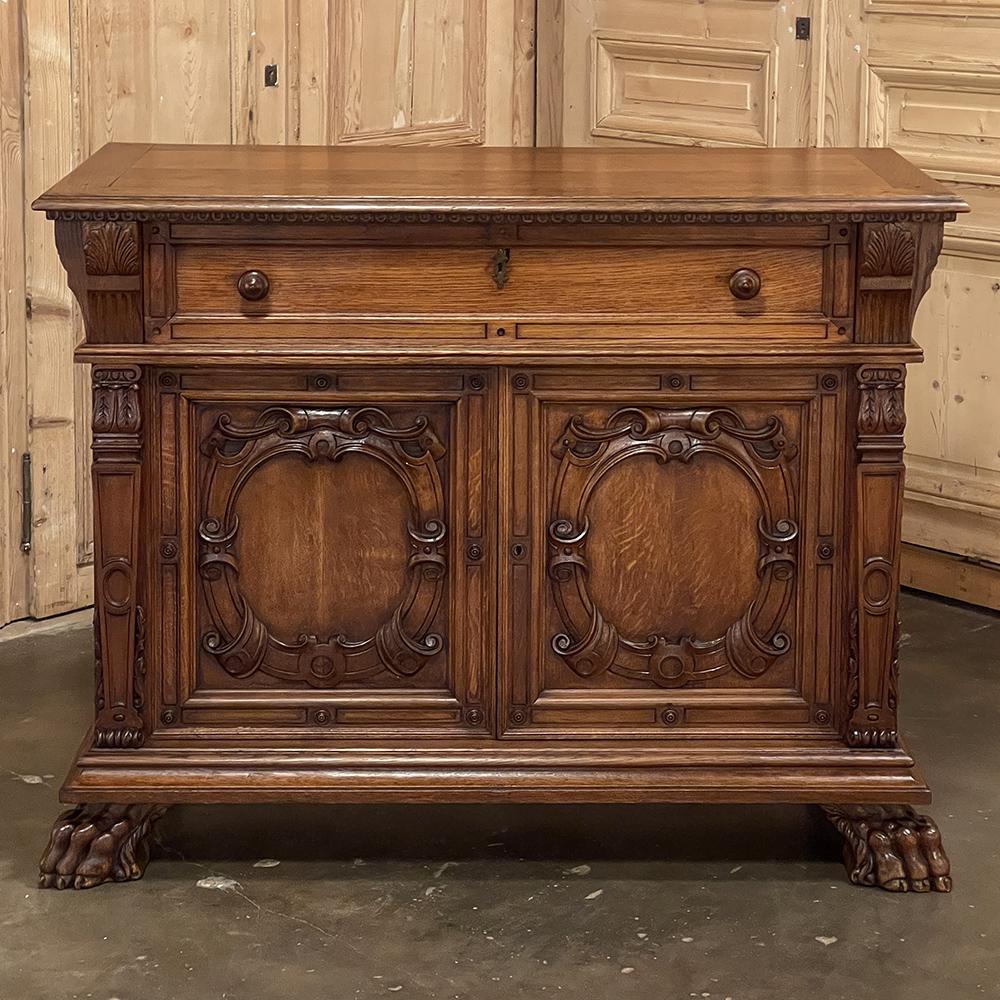 Antique Renaissance Revival Buffet is a spectacular testament to the talents of a premier cabinetmaker, indeed! Designed for a lavish manoir, it was hand-crafted from old-growth indigenous white oak to last for centuries, and features a design