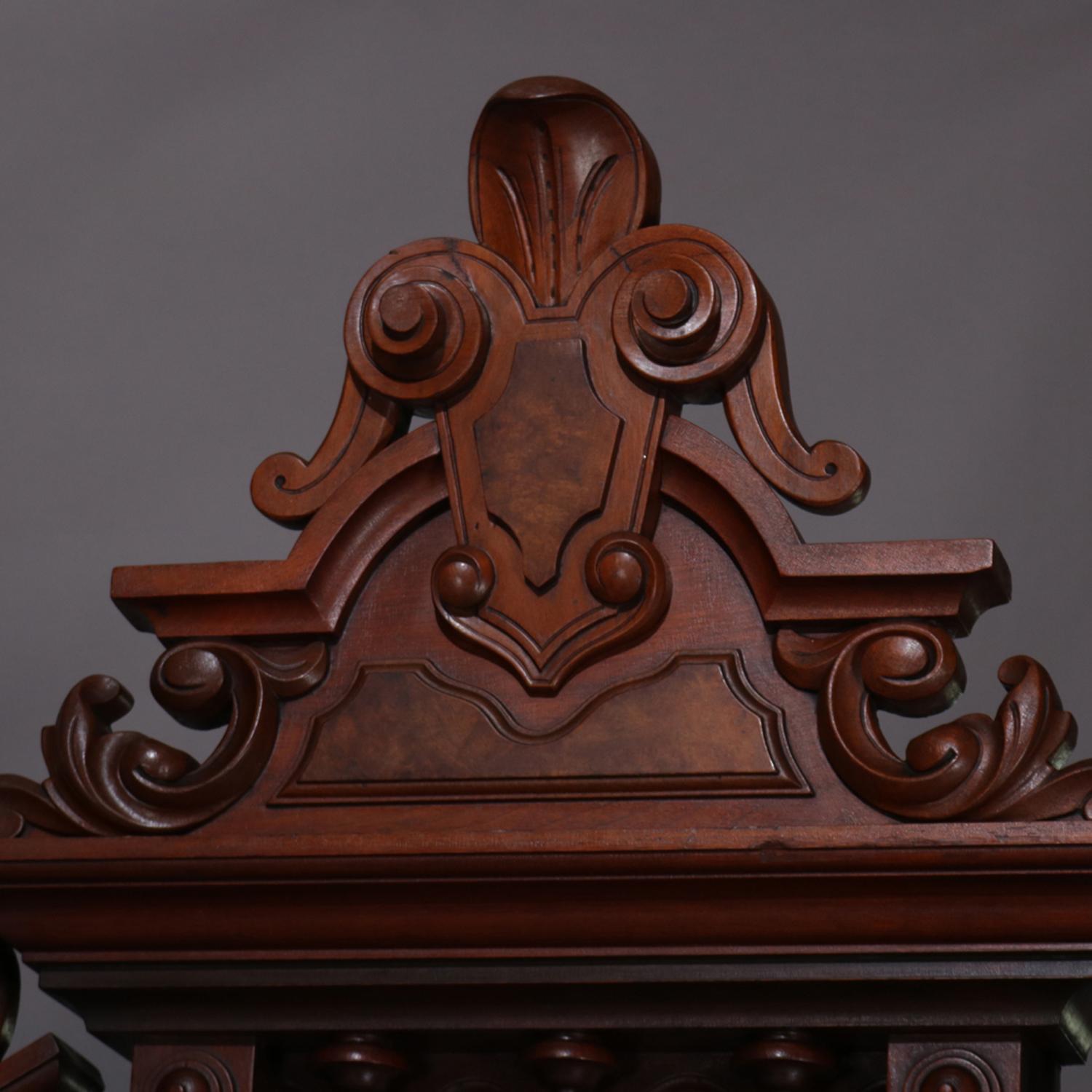 An antique Renaissance Revival bed frame features walnut construction with burl paneled headboard having carved shield and foliate form cartouche and flanked by column form supports, circa 1880.

Measures: overall 103