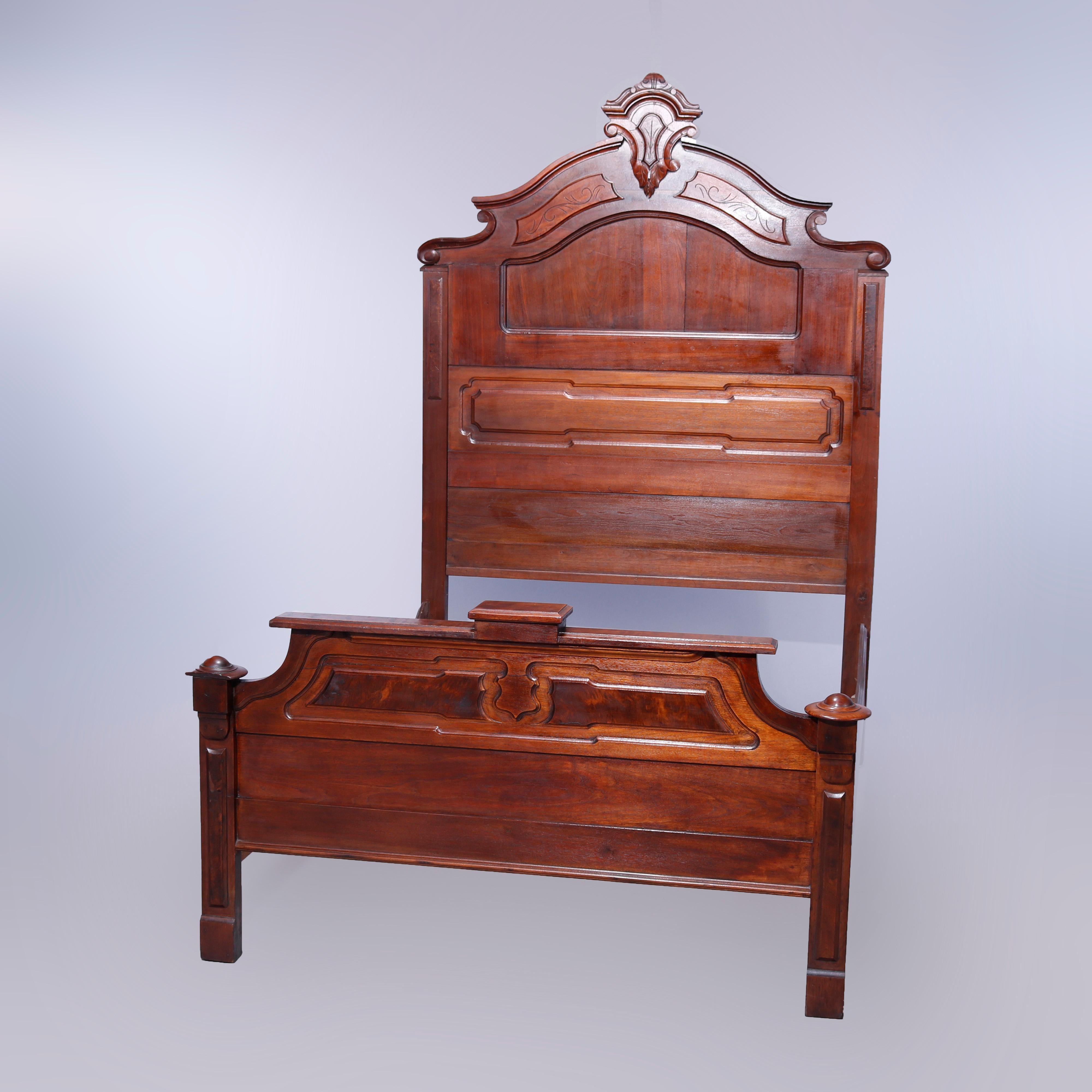 An antique Renaissance Revival high top bed offers walnut paneled construction with burl highlights and shaped headboard having carved shield form cartouche and incised scroll decoration, c1890

Measures- headboard 83.75''h x 57.5''w x 2.5''d;