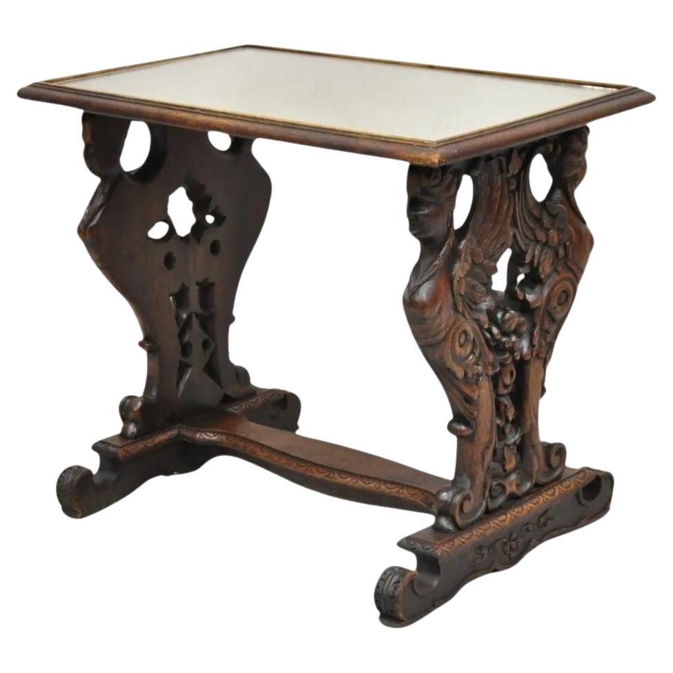 Antigua mesa auxiliar de madera de nogal con tapa de espejo tallada de renacimiento de la doncella alada
