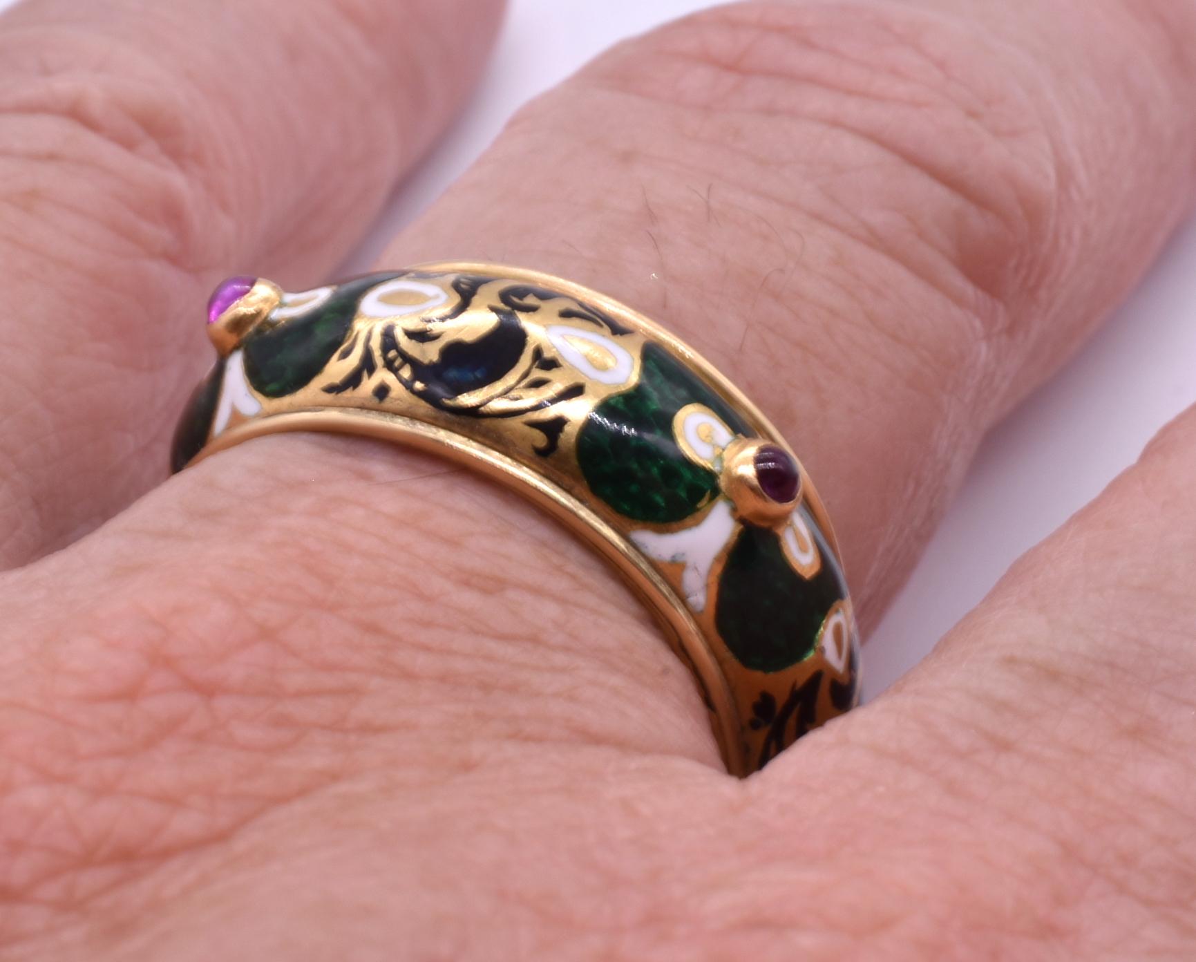 One of a kind antique renaissance revival 18k gold, ruby and green painted enamel  band.  The ring has 4 small rubies spaced around each corner of the band. The ring is US size 10 ½.