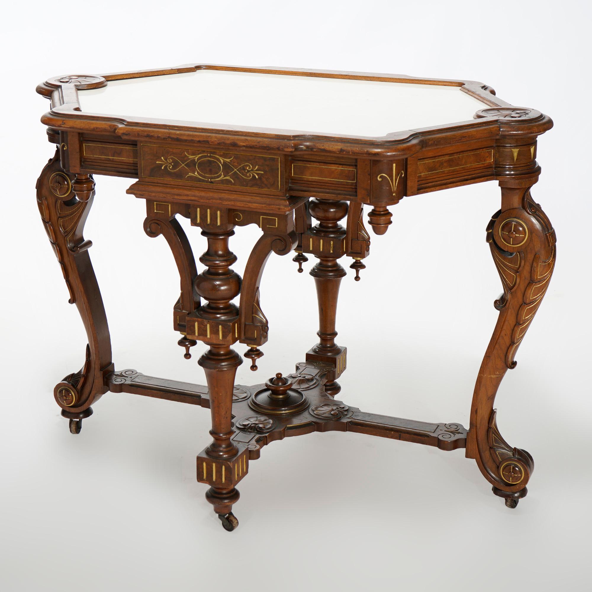 An antique and highly ornate Renaissance Revival parlor table offers walnut and burl construction with shaped picture frame marble top with carved shell elements over base having turned balustrade and cabriole legs, carved acanthus and foliate