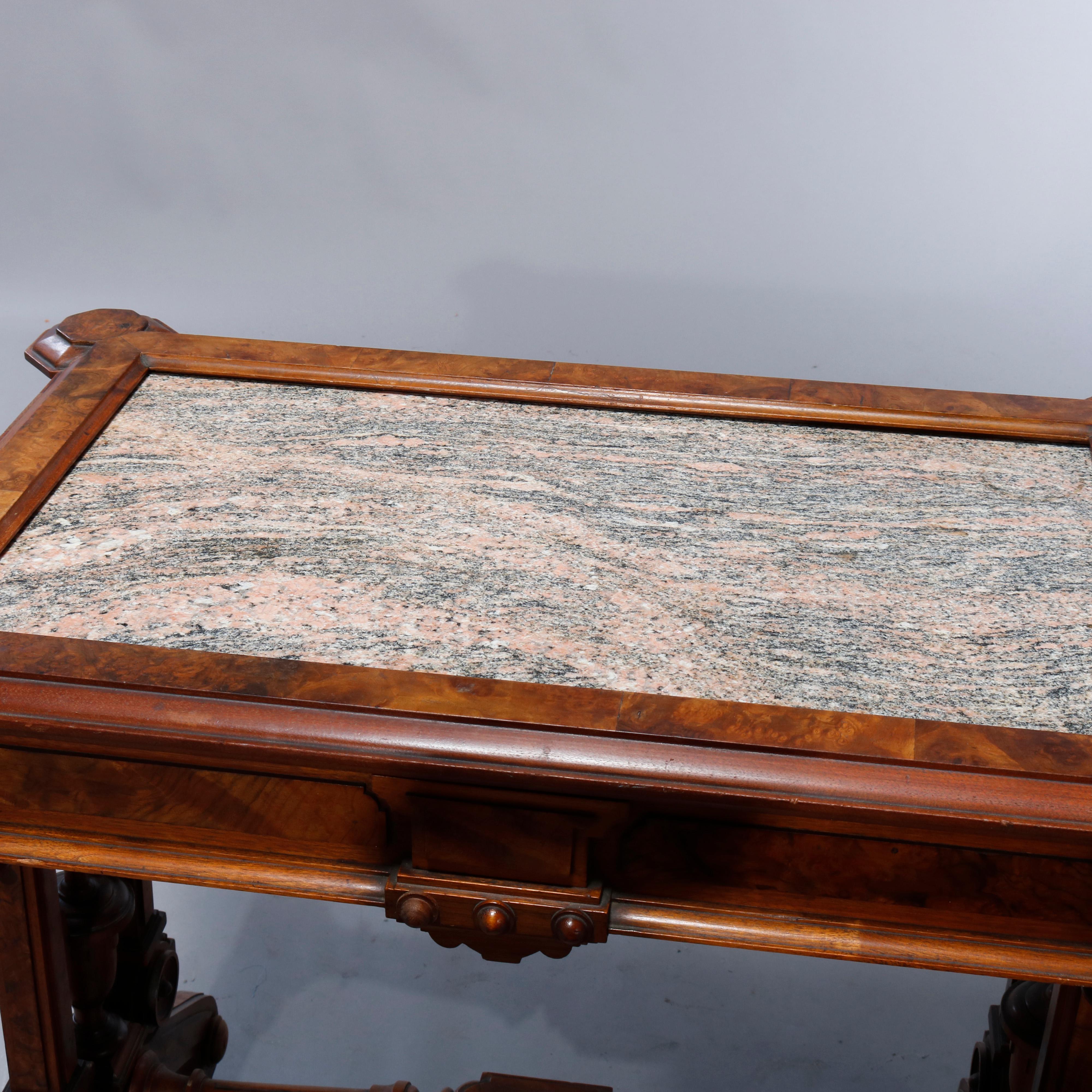 An antique Renaissance Revival parlor table offers picture frame inset rouge marble top over trestle walnut base having burl insets, drop finials and scroll form legs, c1890.

Measures: 29.5