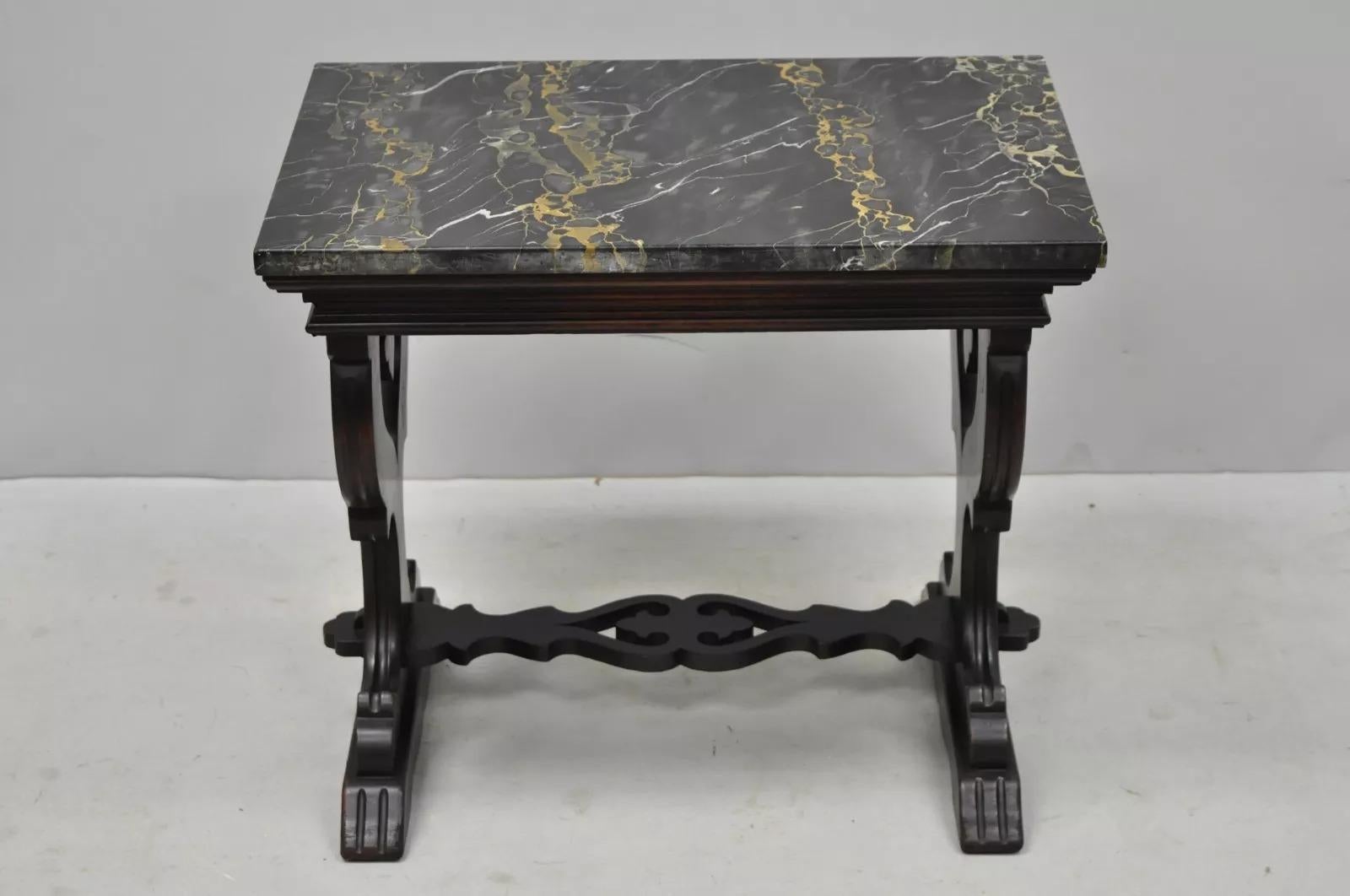 Antique Carved Walnut Marble Top Renaissance Small Side Table tagged Bloomingdale's. Item features carved walnut base, stretcher support, marble top, original label, very nice antique item. Circa Early 20th Century. Measurements: 20.5