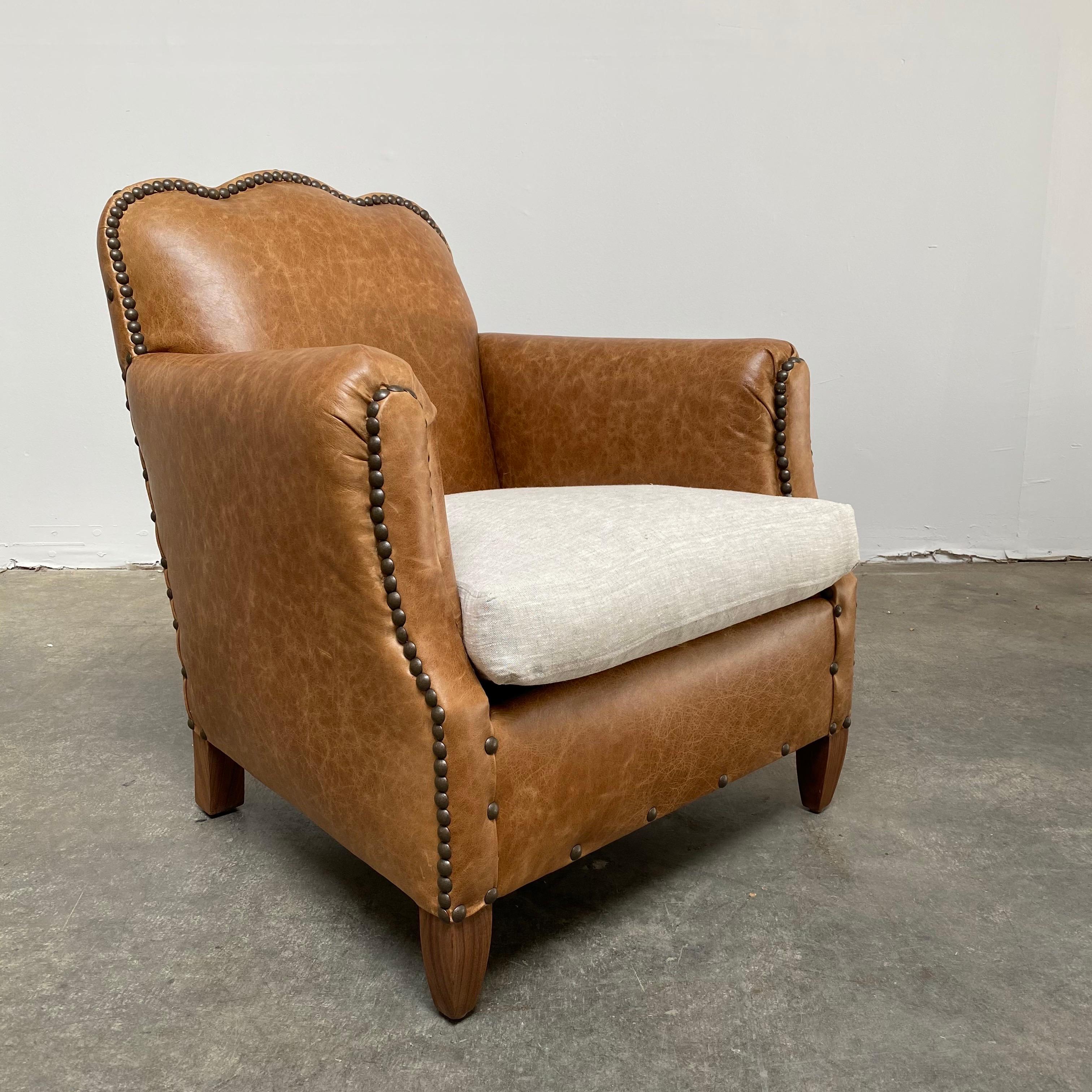 Introducing our clover leather club chair
This reproduction was created from an antique club chair we found in France on our travels.
Custom made to the antique specs, upholstered in Italian semi distressed leather in a saddle brown.
The seat is