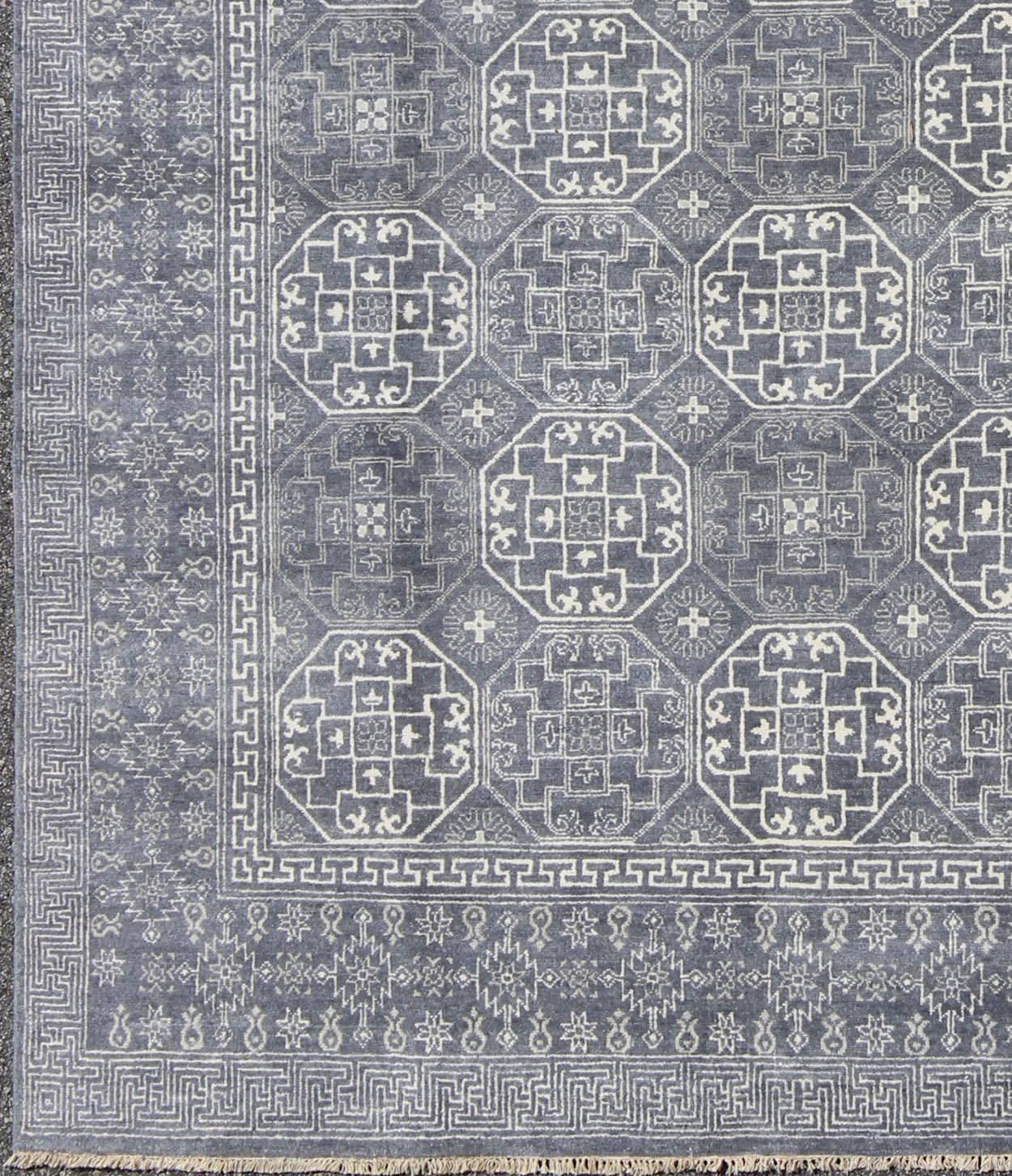 Antique reproduction Khotan rug in shades of gray and blue. Keivan Woven Arts /  rug IN-BAM-59077, country of origin / type: Turkestan / Khotan, 2018.
Measures: 7'11 x 9'10.
This attractive reproduction Khotan rug is a spectacular testament to the