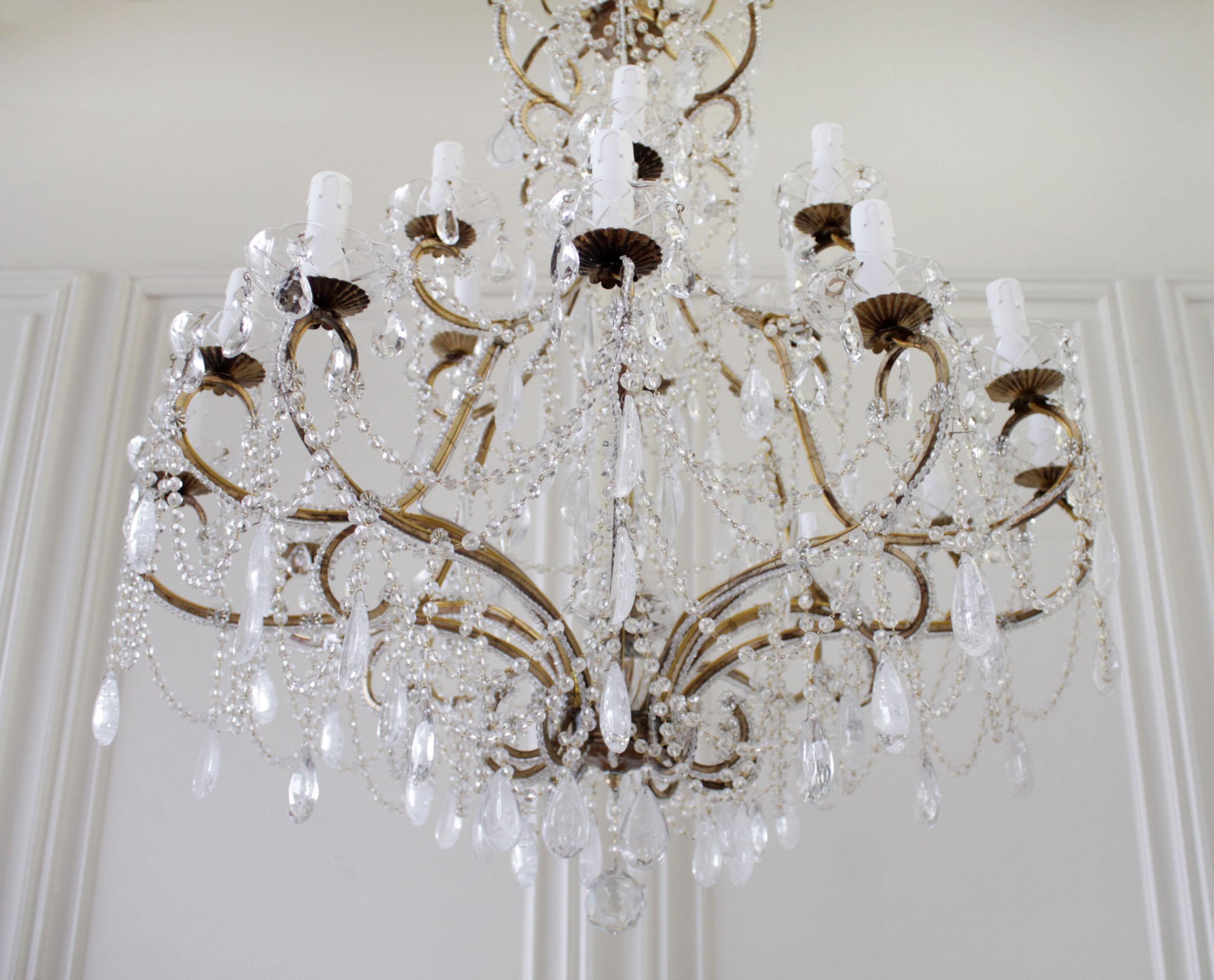 Antique reproduction Italian chandelier with rock style crystals
This beautiful reproduction was designed by Full Bloom Cottage, handmade in Italy. This large tiered chandelier has a macaroni beaded frame, with English style beaded chain, and rock