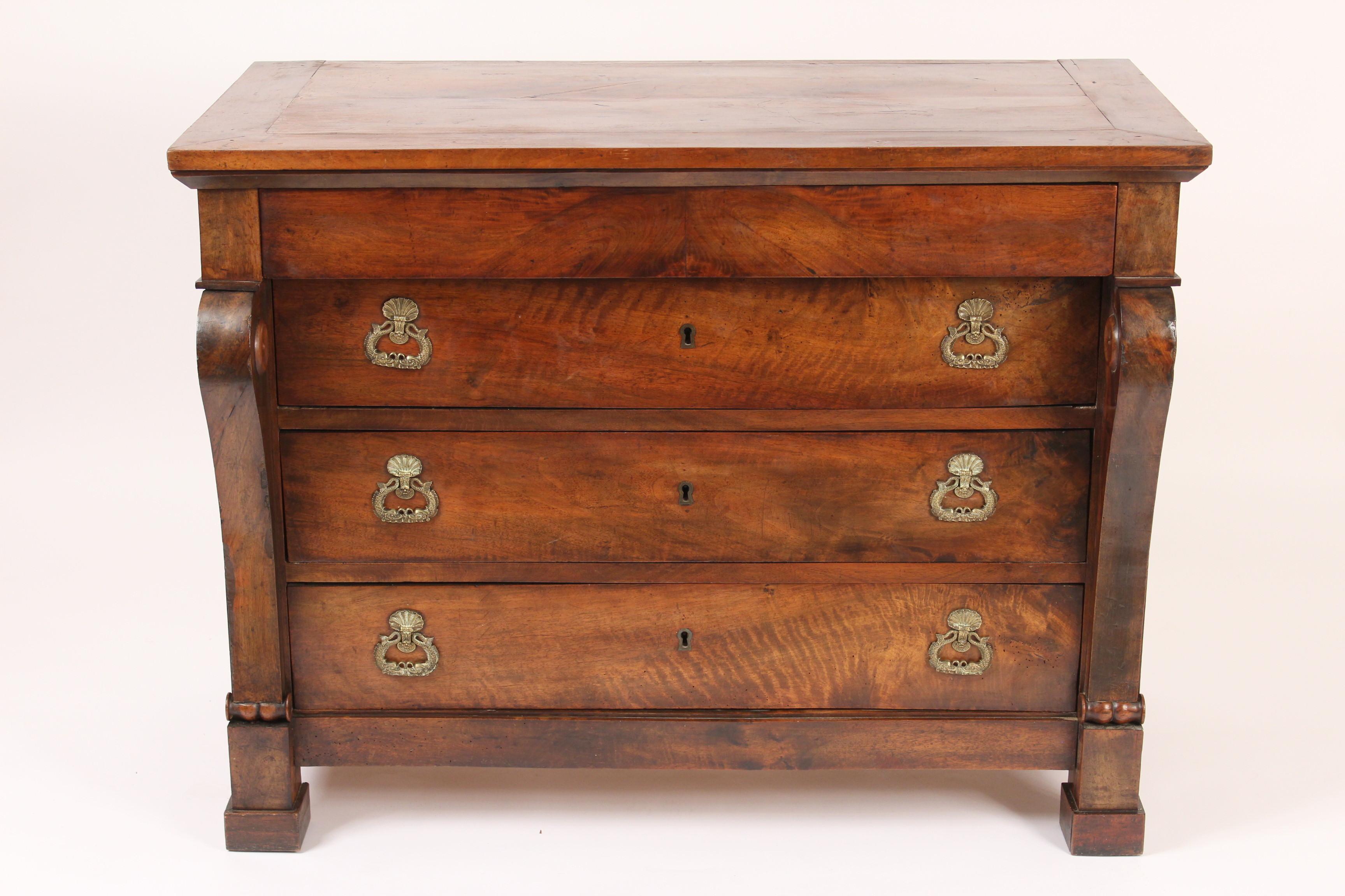 Antique Restauration style walnut chest of drawers, 19th century. Excellent old patina, fine quality pulls and hand dove tailed drawer construction.