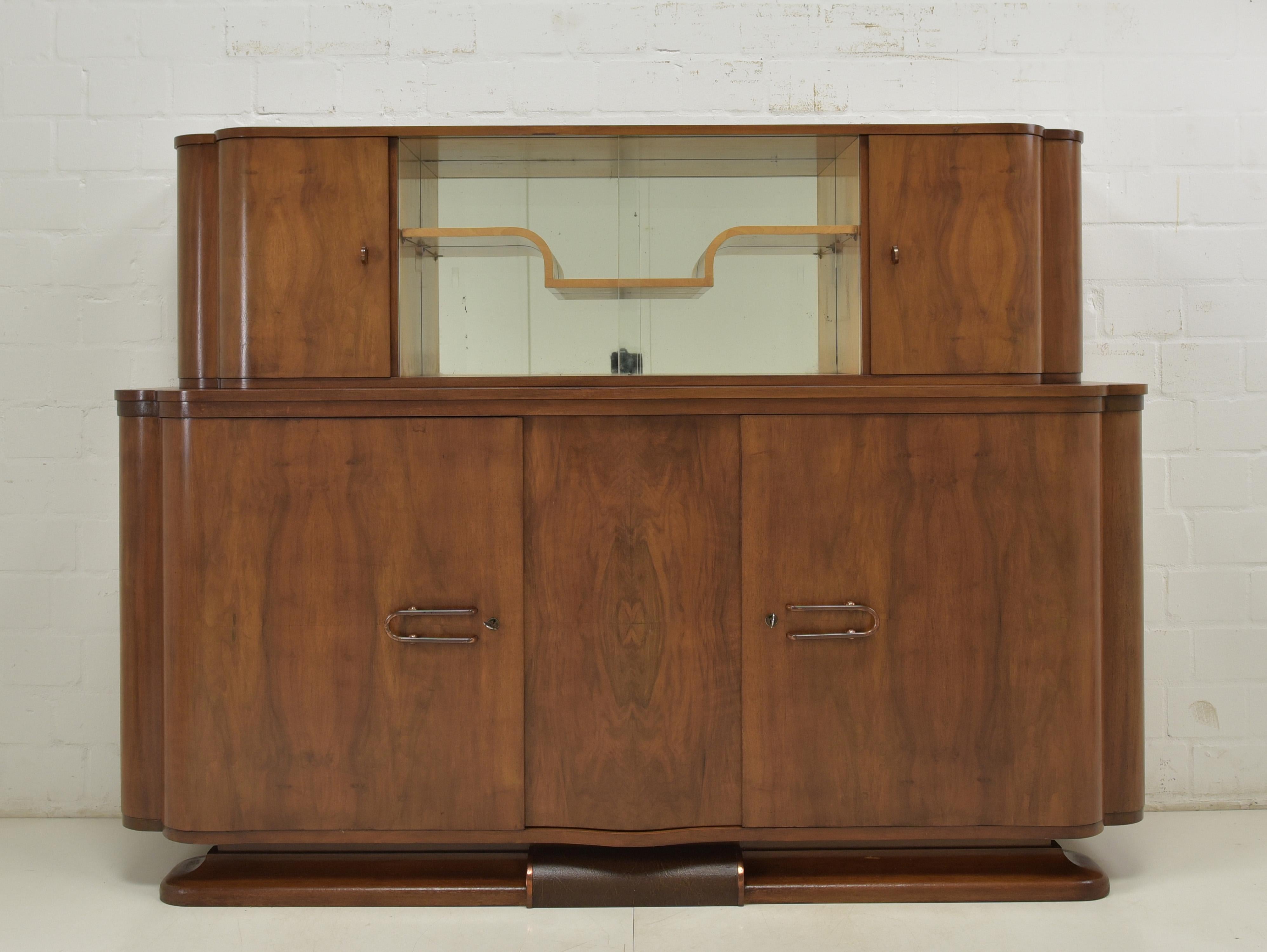 Antique Art Deco Sideboard Buffet

Circa 1935

Dimensions:

Height: 147 cm (57.8 inches)
Width: 200 cm (78.7 inches)
Depth: 57 cm (22.4 inches)

Condition:
This Art Deco sideboard buffet is in very good, restored condition and is ready to be used in