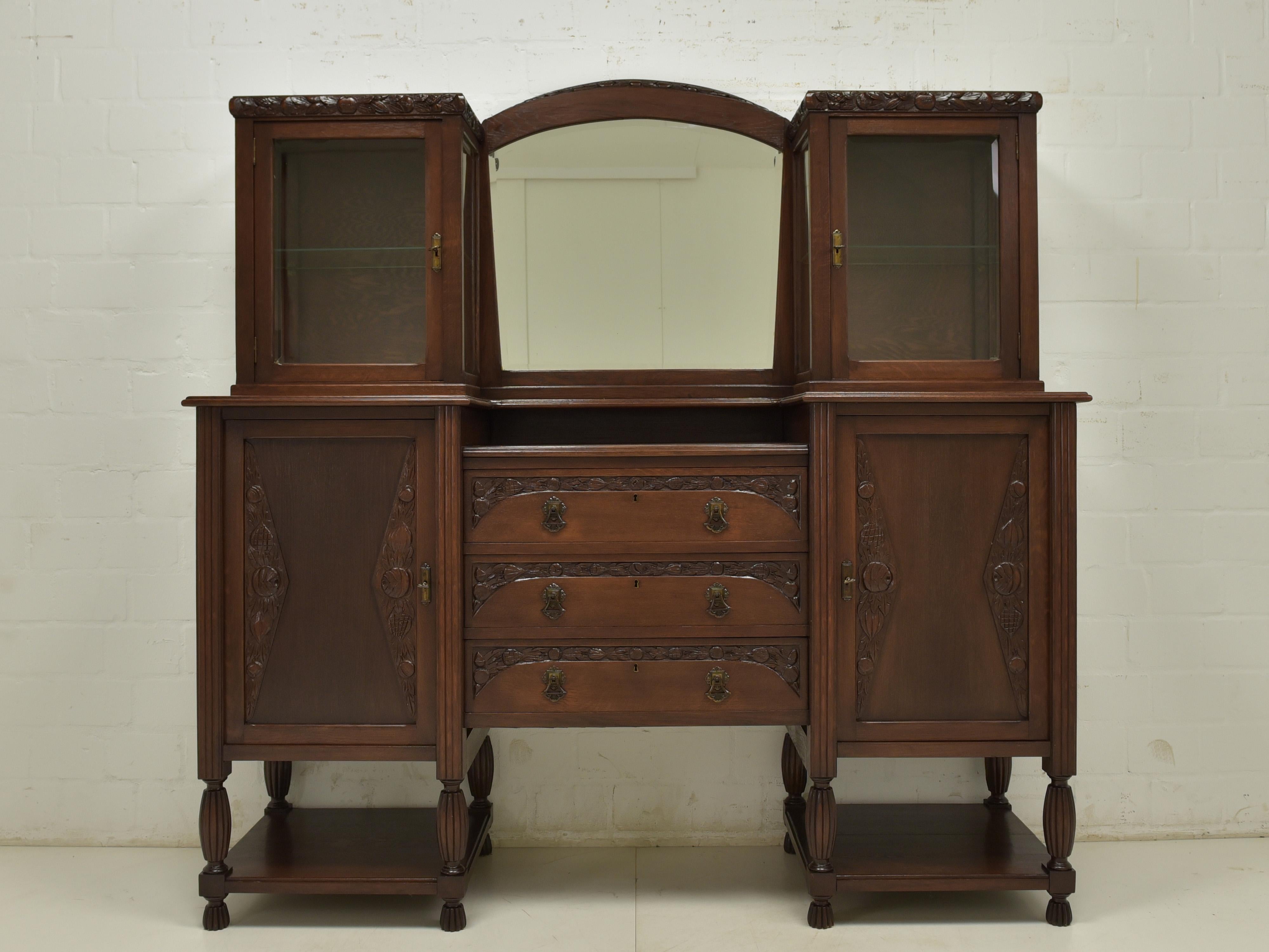 Art Deco Sideboard (Circa 1925)

A Stunning Statement Piece for Your Home

This remarkable Art Deco sideboard, crafted from almost entirely solid oak around 1925, is a true masterpiece of design and craftsmanship. Its elegant lines, geometric