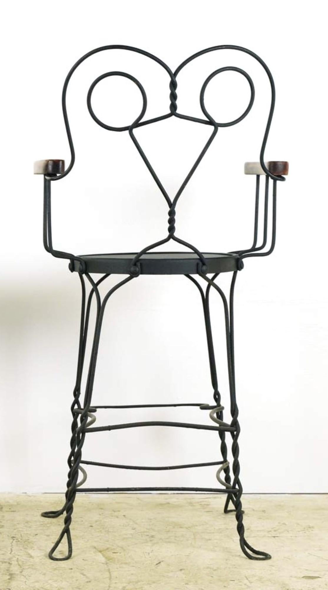 Antique counter height billiard room chair with a wrought iron frame and oak armrests. This has been repainted recently, and the wood arms were restored. The condition is very good. Small quantity available at time of posting. Please inquire. Priced