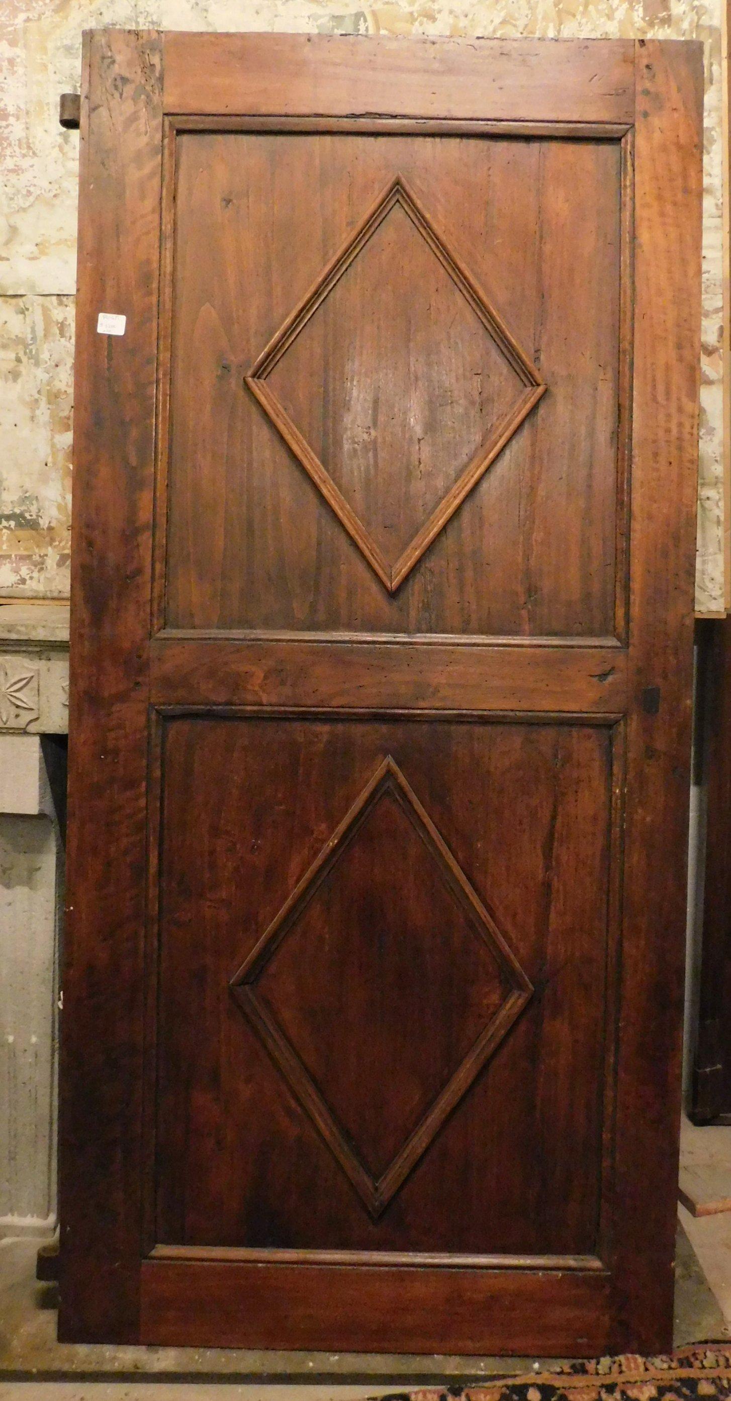 Ancient restored poplar door, with lozenges carved on the surface, built in the 18th century in Italy.
Hand-sculpted, it still has its original hinges for push opening from the left, finished back.
Measure cm w 87 x h 187 x t 3.