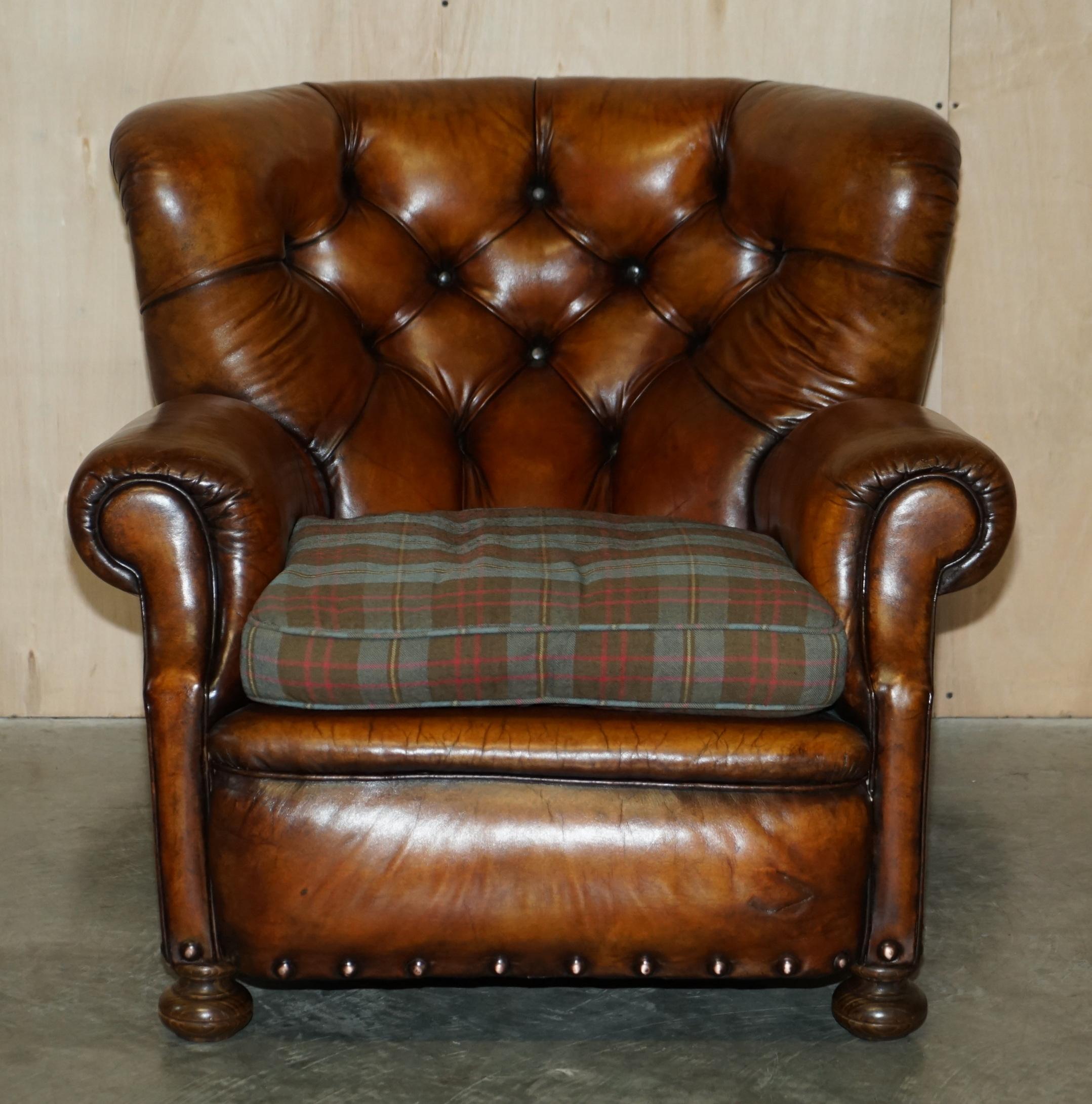 We are delighted to offer for sale this absolutely stunning, hand dyed saddle brown leather Victorian club armchair with Chesterfield tufting, wool tartan cushion and coil sprung front edge

A very well made, decorative and extremely comfortable