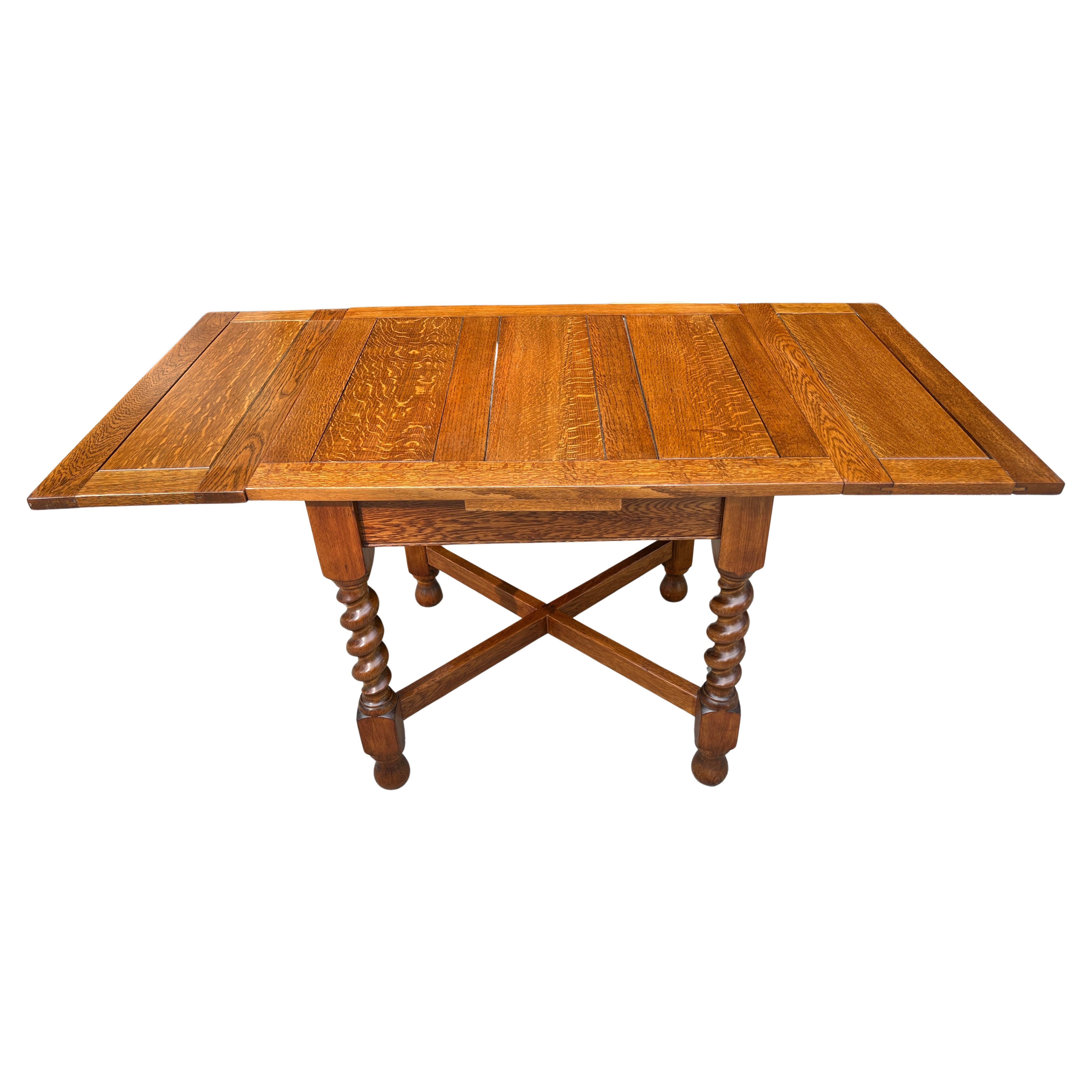  Vintage old growth oak Draw Leaf Barley Twist Pub Style Table from England. This table is well made of Oak very solid and very stable. An excellent breakfast table in a nook or quite a nice game table for cards & board games. It would also make a