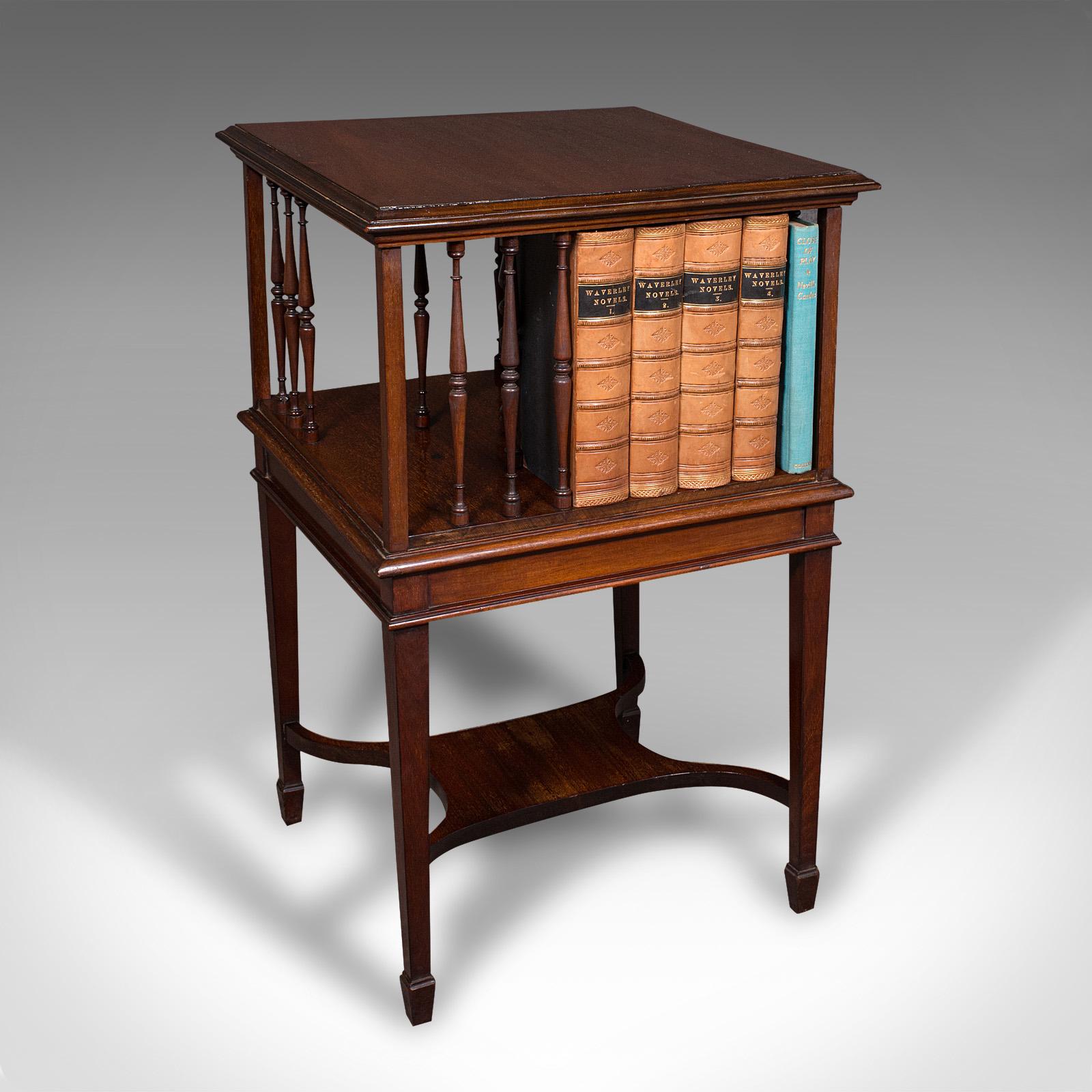 
This is an antique revolving bookcase. An English, walnut rotating novel library, dating to the Edwardian period, circa 1910.

Attractive rotating library, handy to keep favourite titles to hand
Displays a desirable aged patina and in good