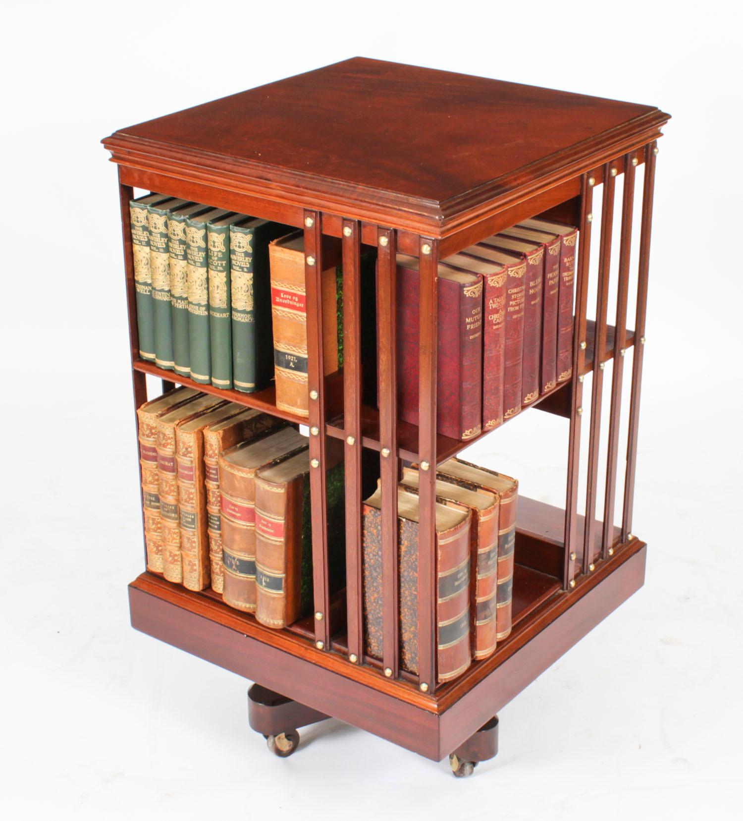 This an exquisite antique revolving bookcase  attributed to the renowned Victorian retailer and manufacturer Maple & Co., circa 1900 in date.

It is made of flame mahogany and revolves on a solid cast iron base, the best quality  revolving bookcases