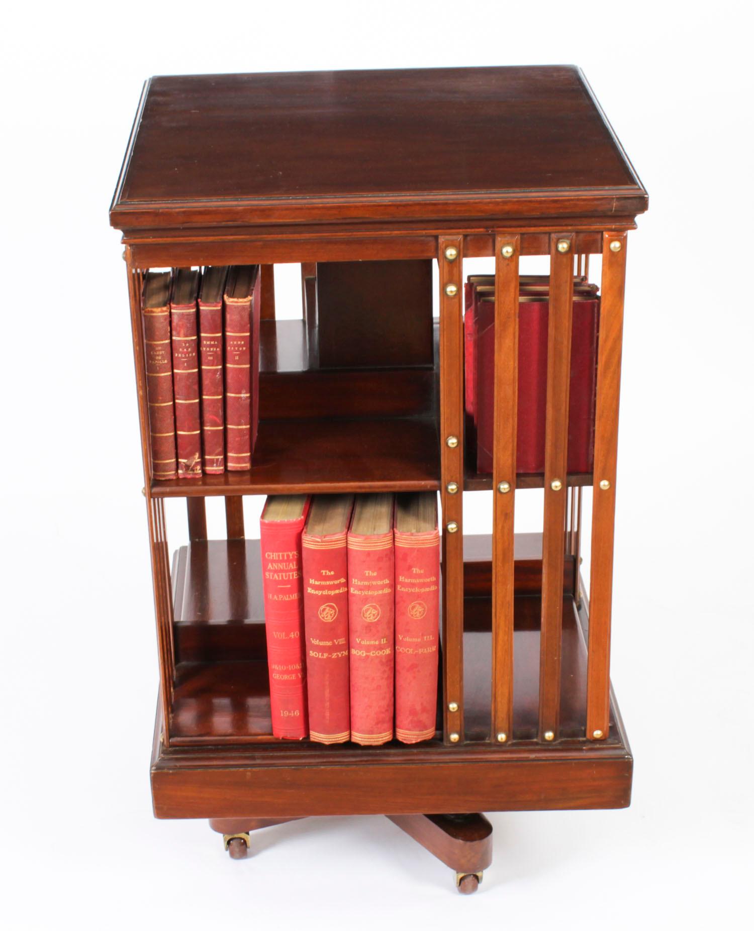 This an exquisite antique revolving bookcase attributed to the renowned Victorian retailer and manufacturer Maple & Co., circa 1900 in date.
 
It is made of mahogany, revolves on a solid cast iron base, the best quality Edwardian revolving