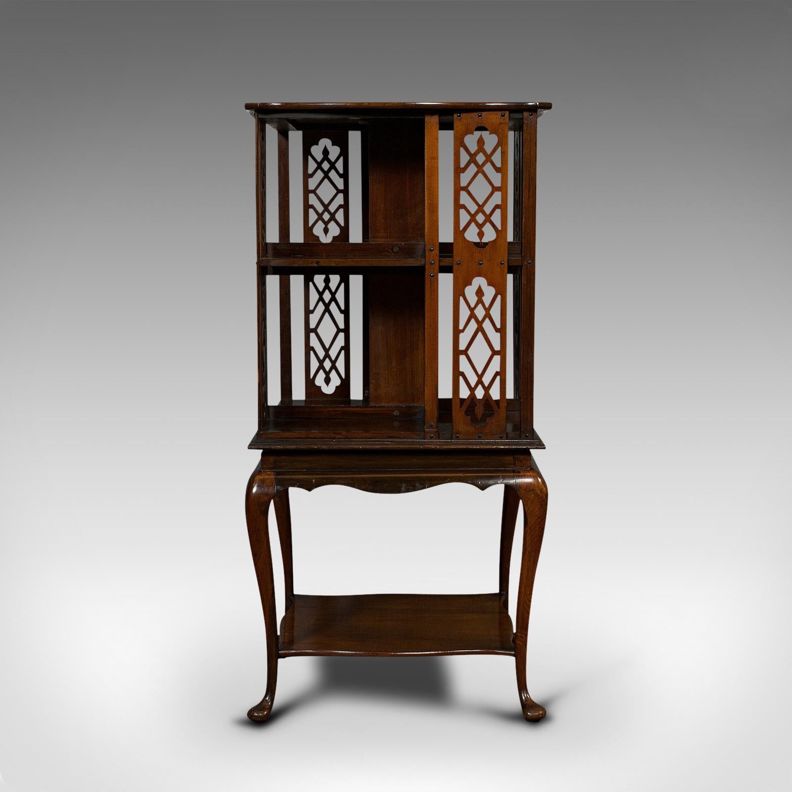 This is an antique revolving library. An English, walnut bookcase table, dating to the Edwardian period, circa 1910.

Impressive, ornate bookcase
Displays a desirable aged patina
Select walnut resplendent with fine grain interest
Rich, deep