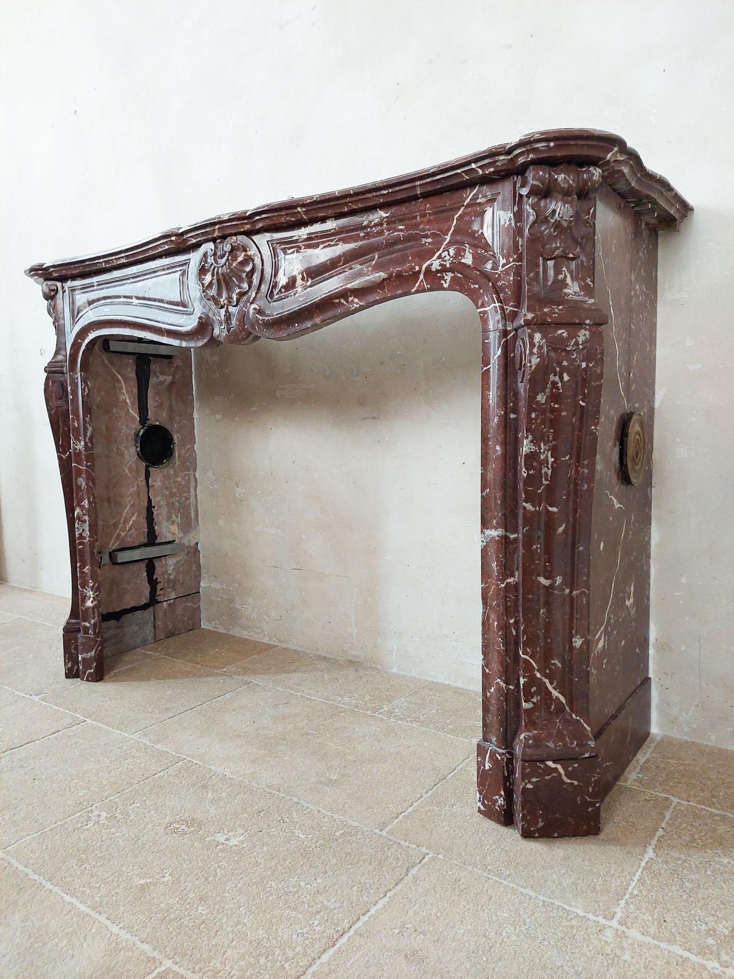 Antique, rich, hand-carved Trois Coquilles mantelpiece in red marble For Sale 6