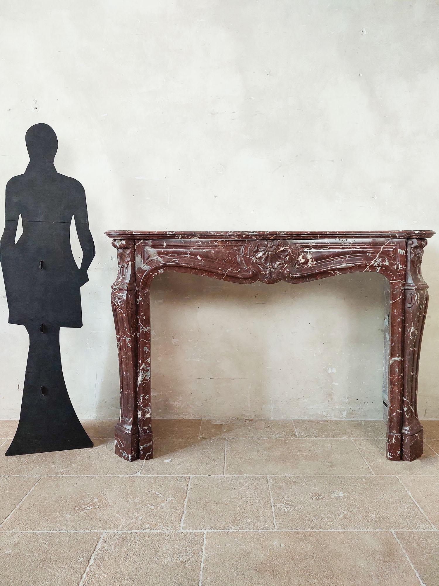 French Antique, rich, hand-carved Trois Coquilles mantelpiece in red marble For Sale