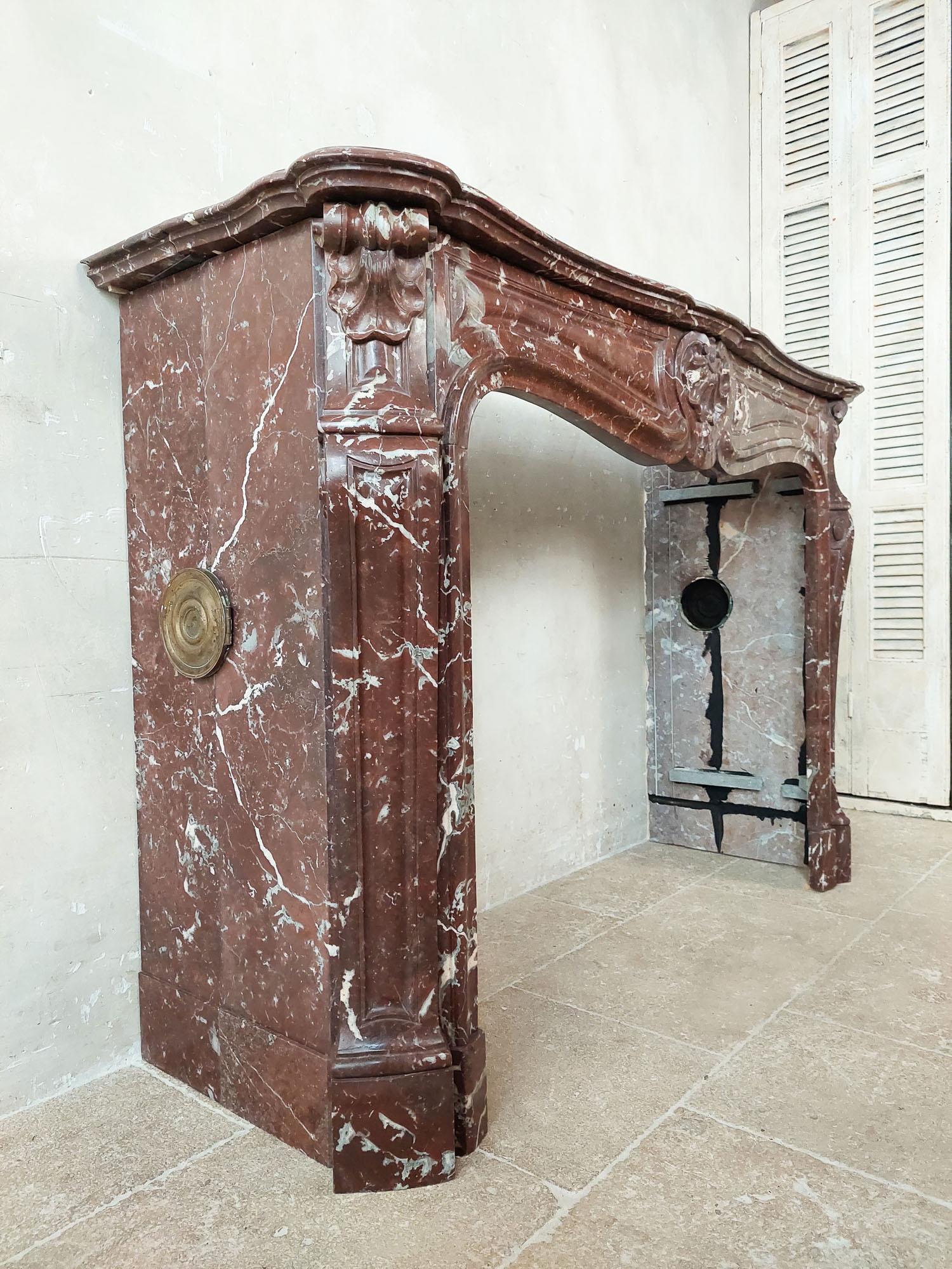 19th Century Antique, rich, hand-carved Trois Coquilles mantelpiece in red marble For Sale