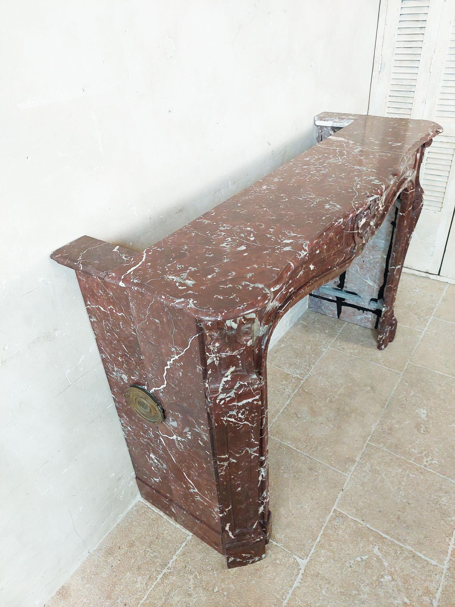 Marble Antique, rich, hand-carved Trois Coquilles mantelpiece in red marble For Sale