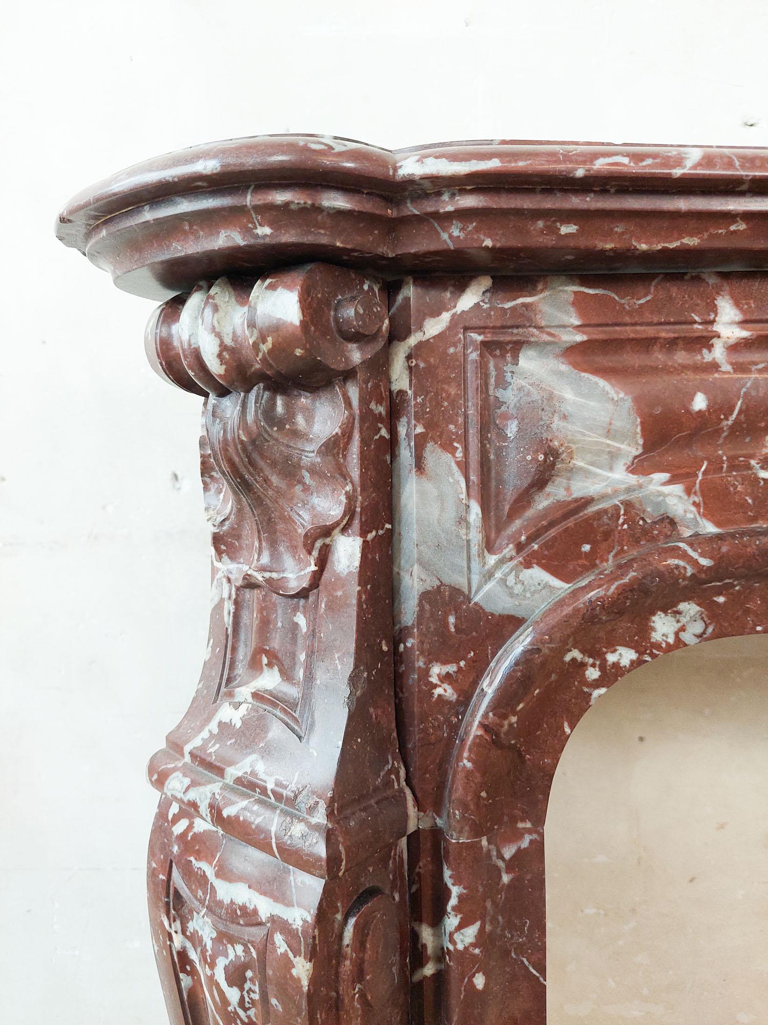 Antique, rich, hand-carved Trois Coquilles mantelpiece in red marble For Sale 1