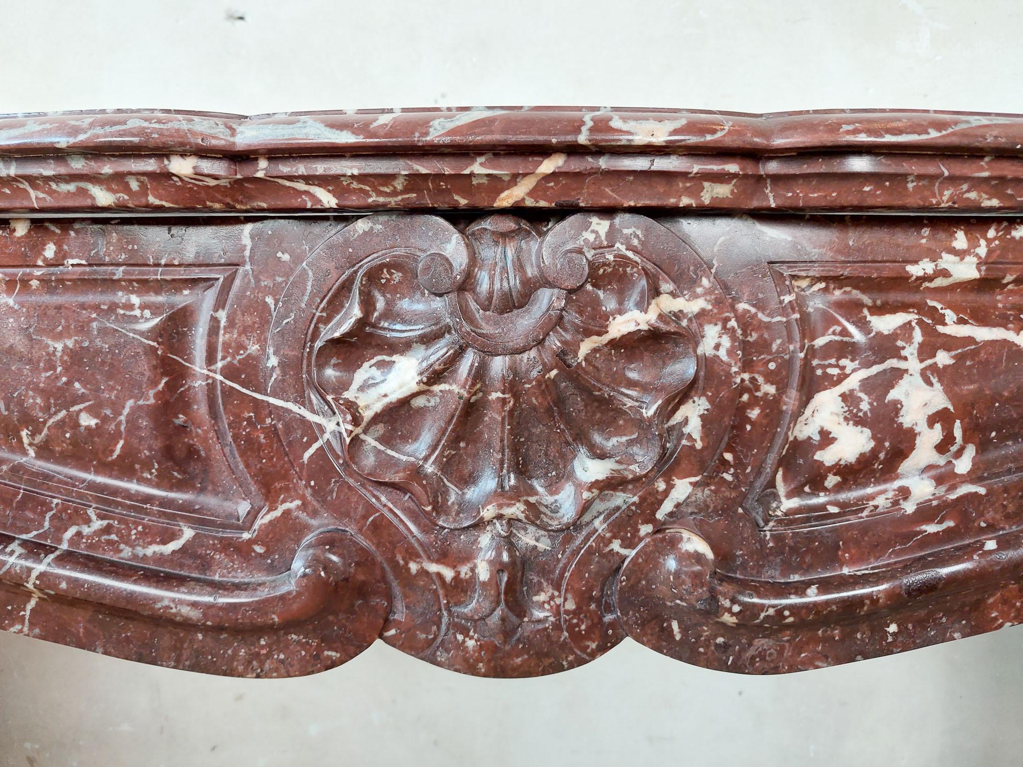 Antique, rich, hand-carved Trois Coquilles mantelpiece in red marble For Sale 2