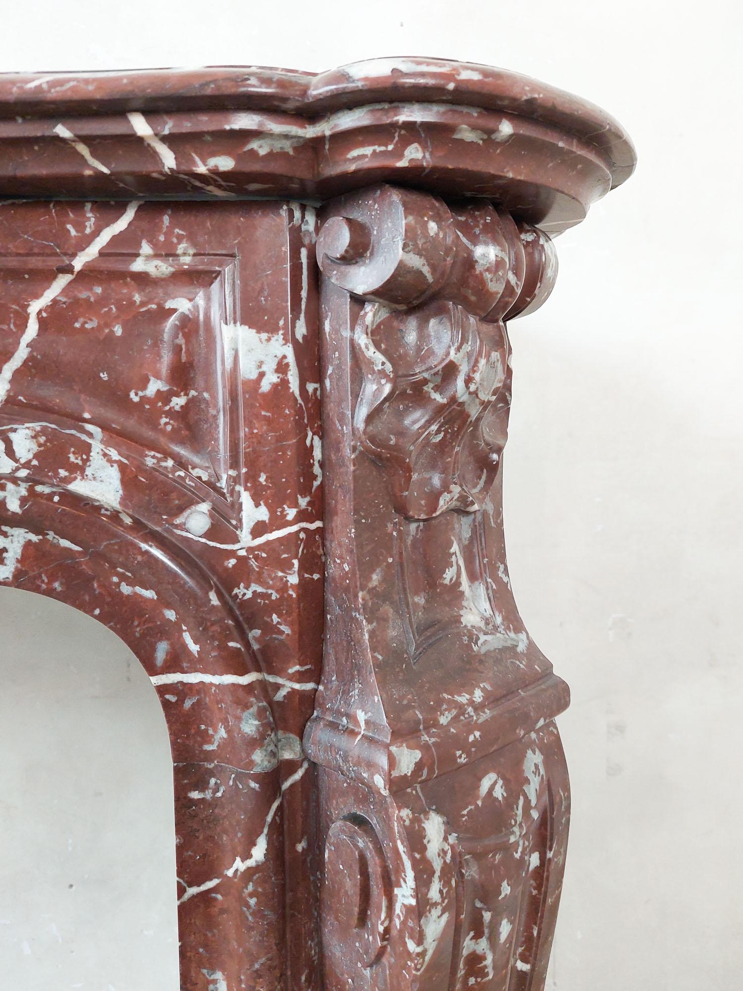 Antique, rich, hand-carved Trois Coquilles mantelpiece in red marble For Sale 3