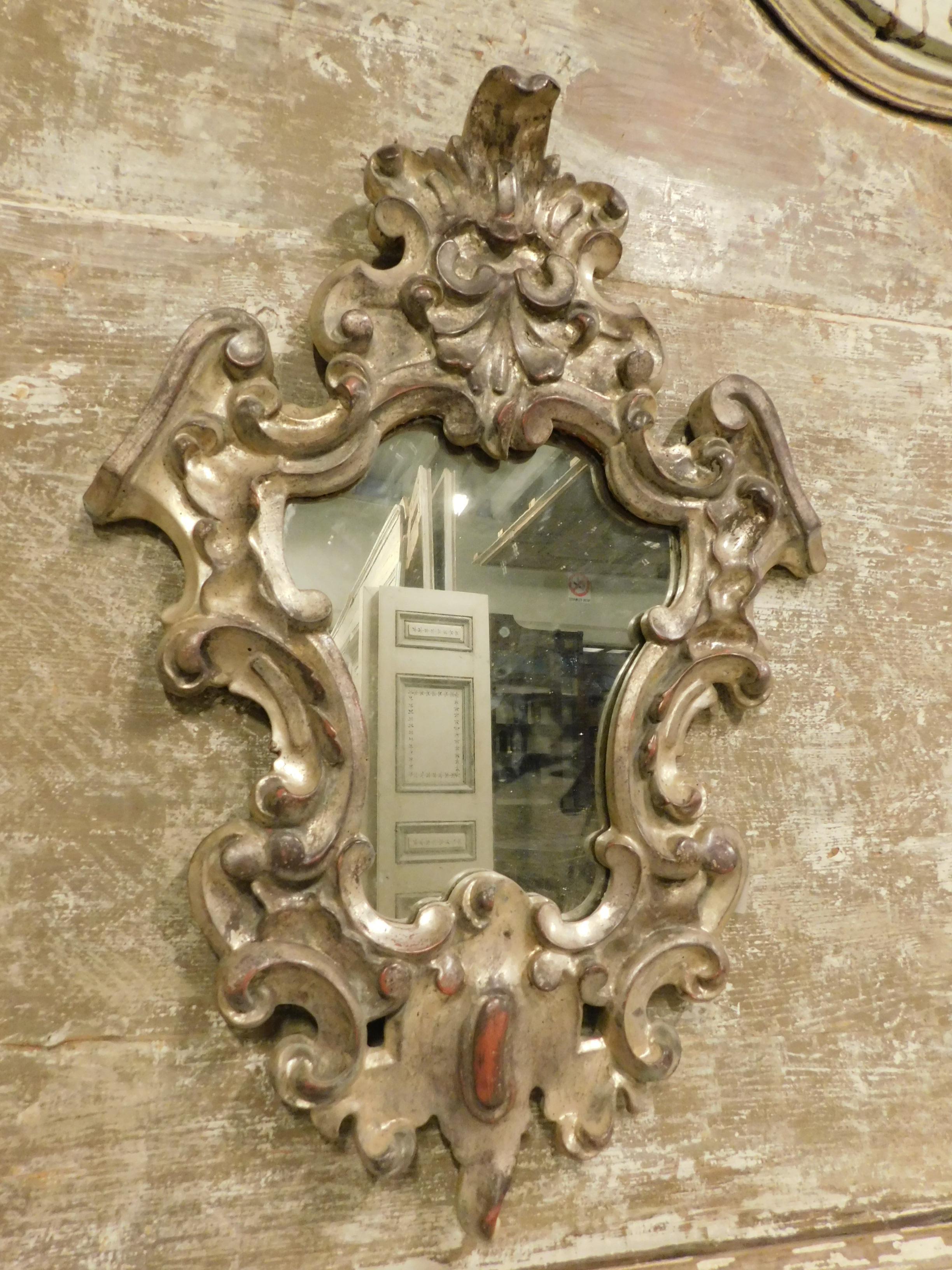 Antique fan mirror, richly carved in wood and silver leaf, built entirely by hand in the 18th century in Italy (Piedmont), ideal as a bathroom mirror, office, shop or interior of any kind, beautiful antique patina, to be adapted also in a larger