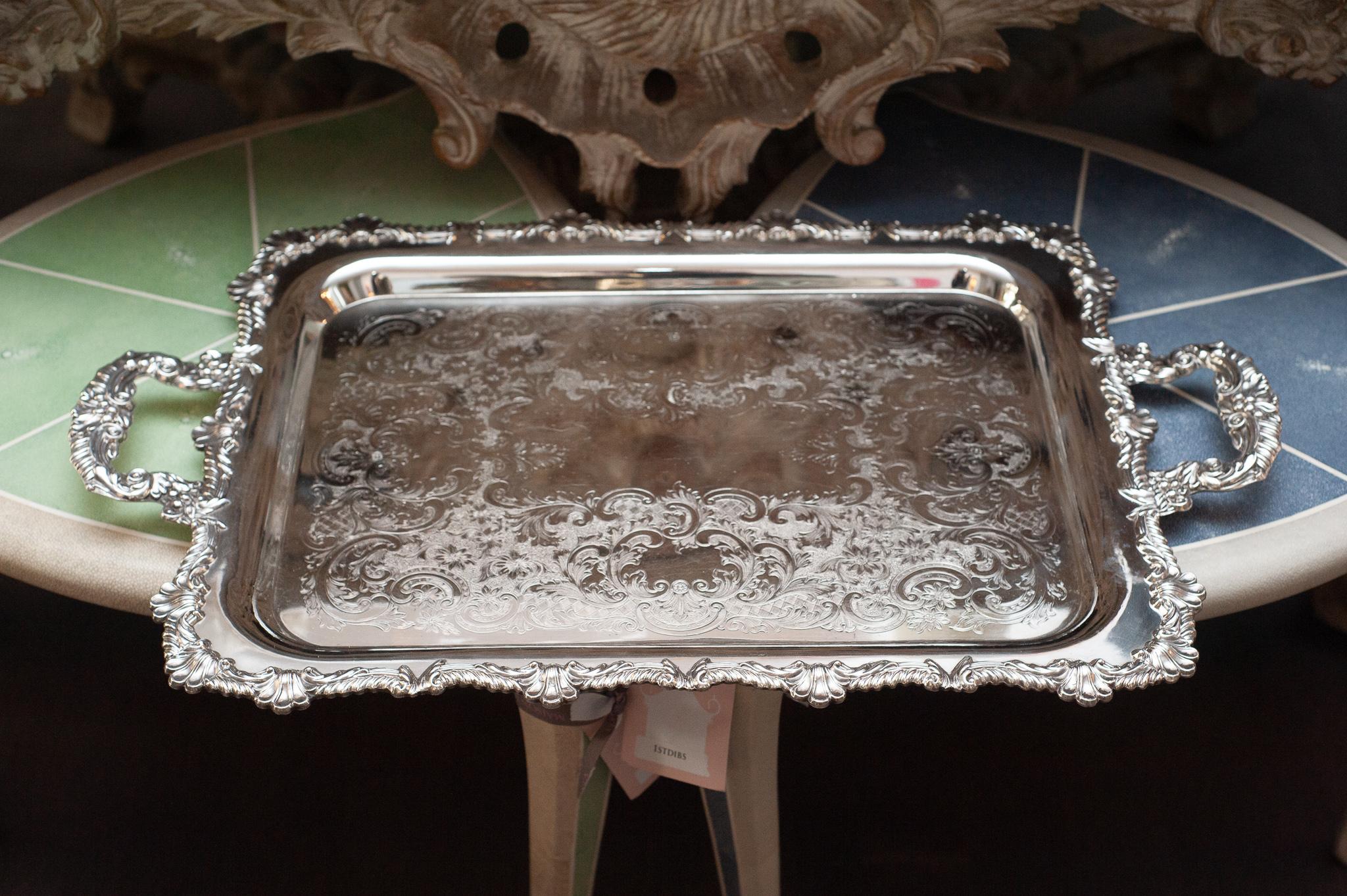 An antique large Rideau silver plate rectangular serving tray with engraving interior and ornate border with handles.