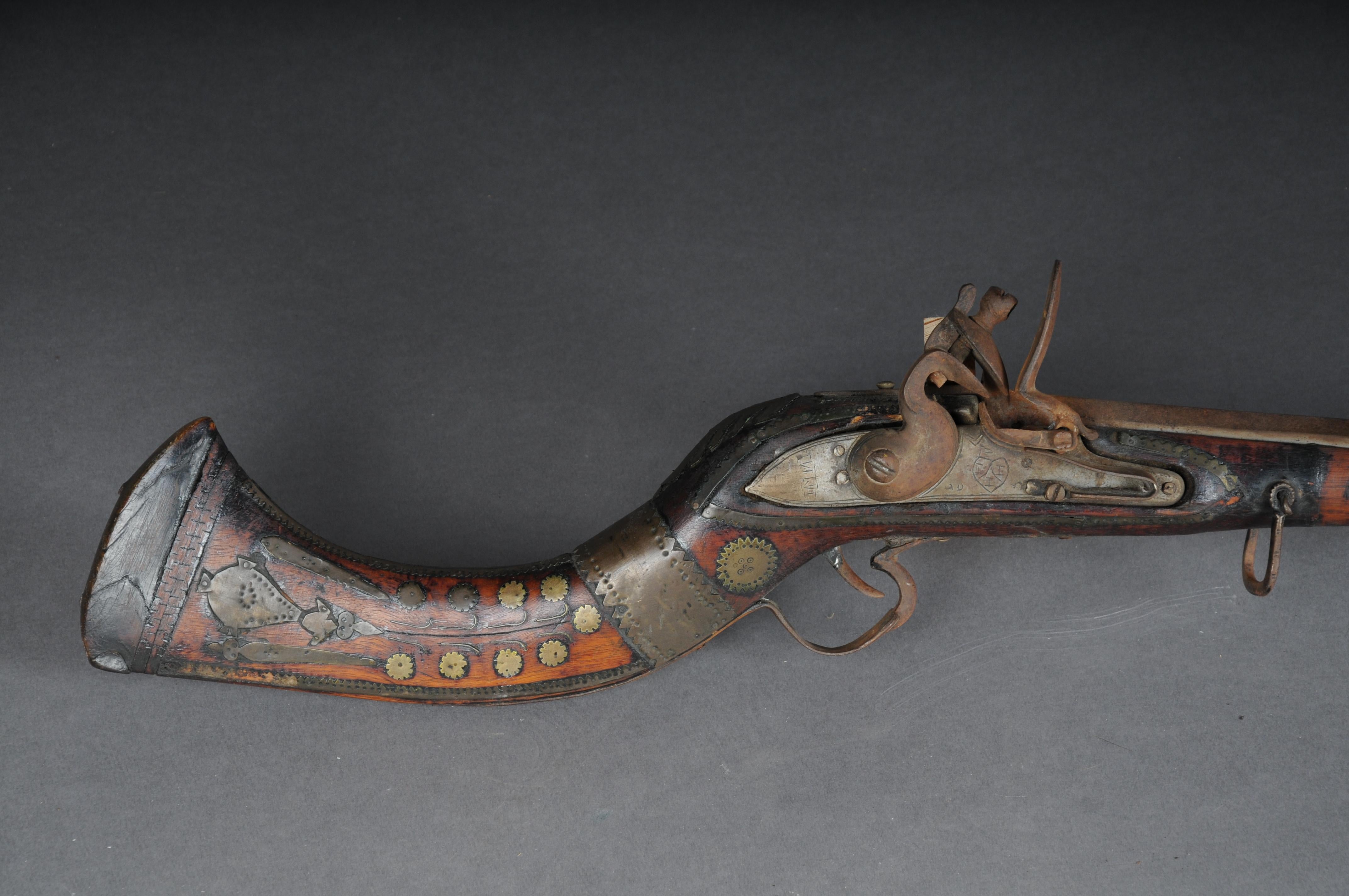 Antique rifle, North Africa around 1910

Historical rifle (long gun) probably from the Magreb States (North Africa) with beautiful iron and brass inlays. Is ideal for collectors or decorative purposes.
