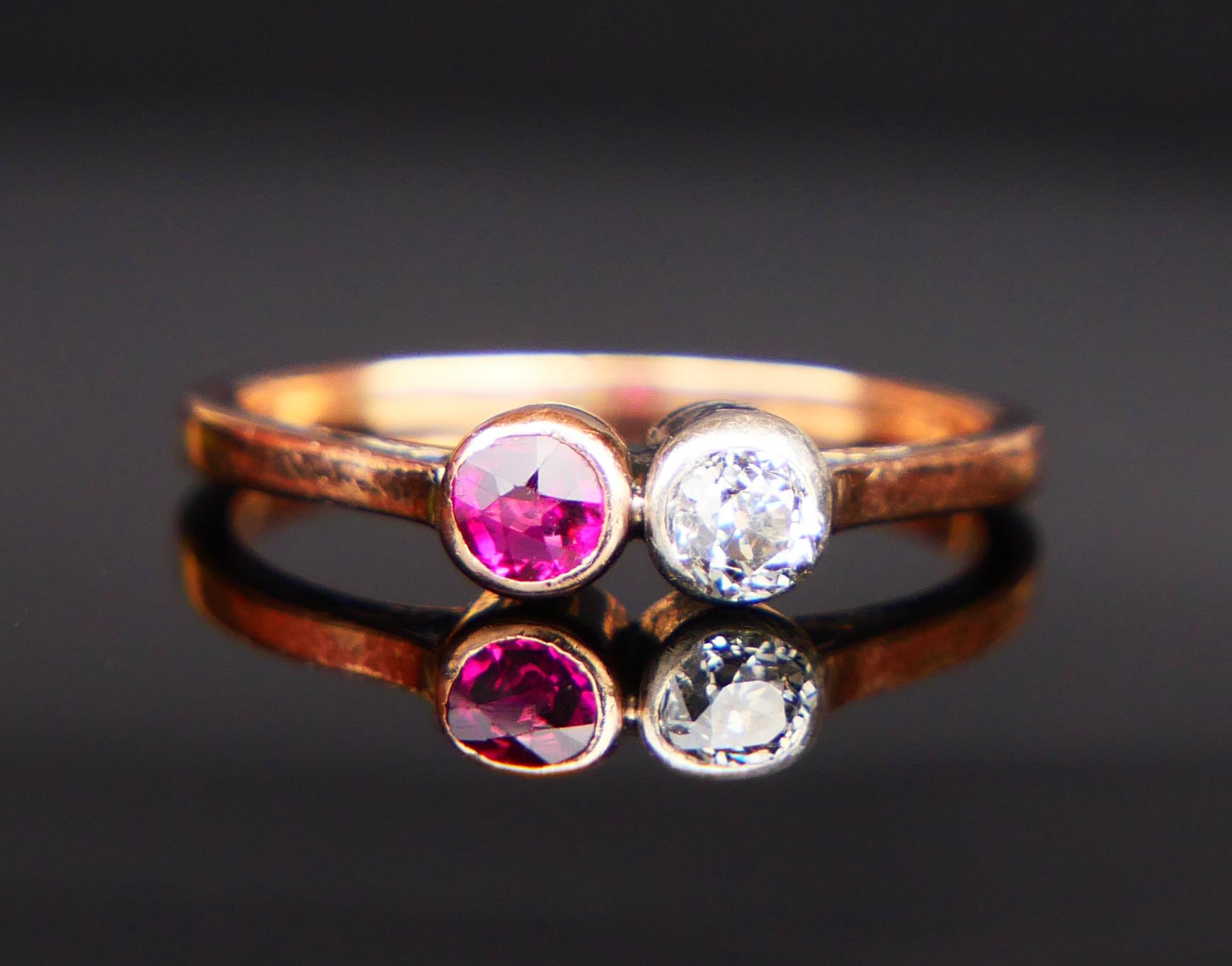A Ring from ca. 1920s - 1930s with the band in solid 14K Rose Gold decorated with old European cut Diamond Ø 3.5 mm / ca.0.2 ct /color G,H/SI in Silver bezel and old cut Ruby in Rose Gold bezel Ø 3 mm / ca.0.2 ct. Both stones with open backs.

No