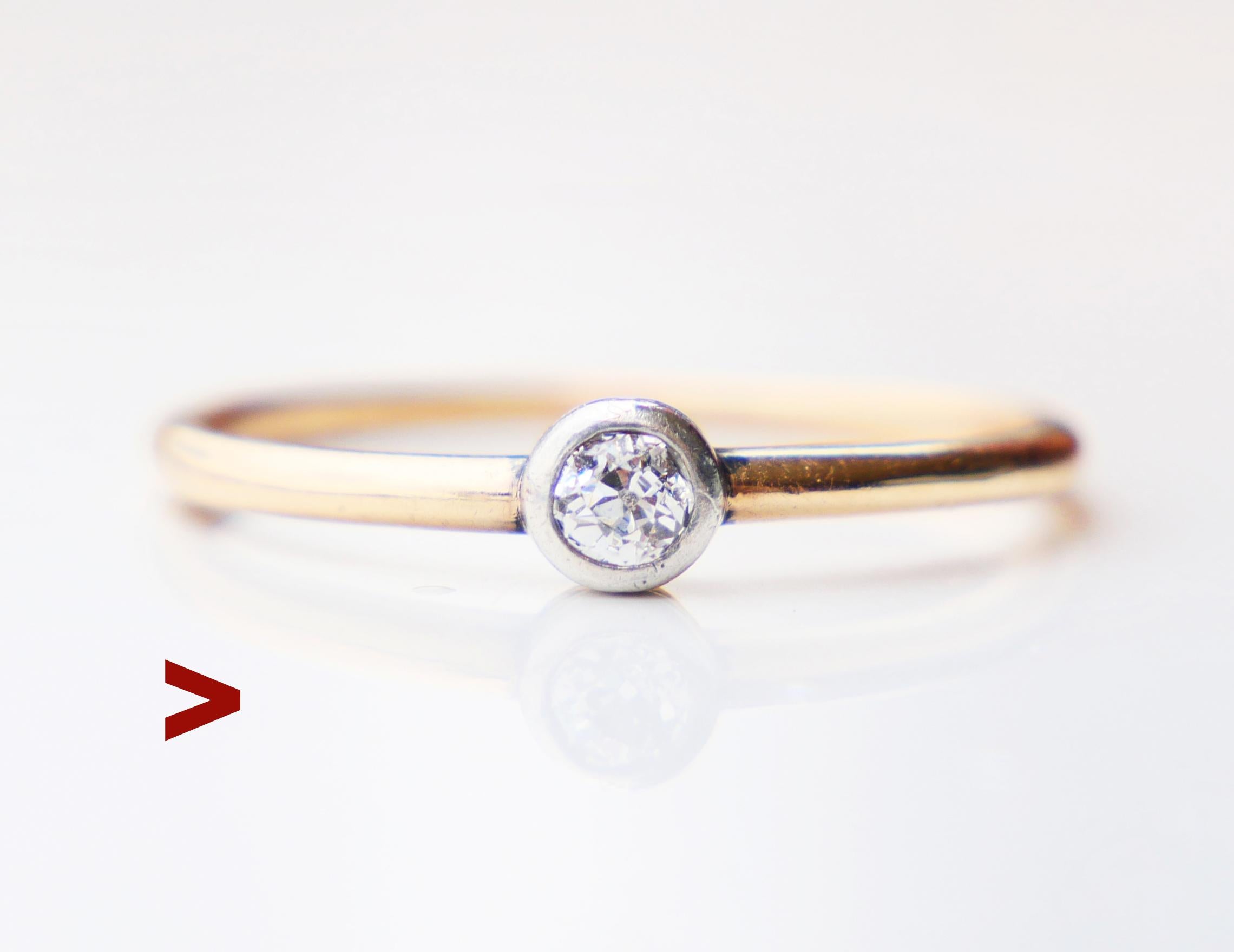 European ring from early XX century period with band in solid 14K Yellow Gold with silver bezel holding a Diamond Ø 3.25 mm x 1.9 mm deep / ca.0.2 ct , color ca,G,H /VS , with open back .

Fragmented hallmarks. Metal tested solid 14K Gold.

Size : Ø
