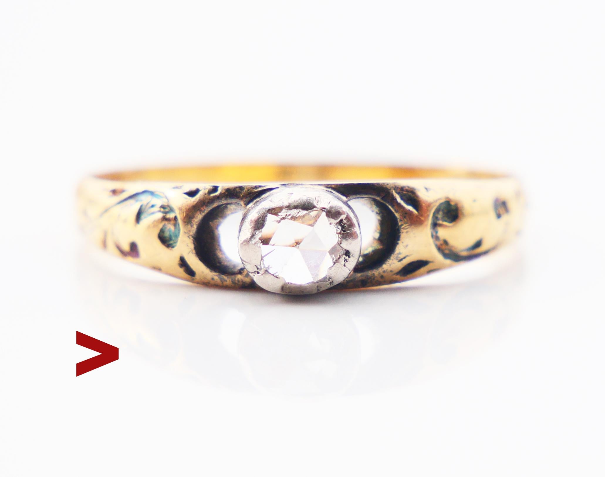 Fine Antique Ring, likely Swedish, ca. late XIX - early XX century.

Solid 18K Yellow Gold band with engraved and enameled decorations on the shoulders. Round rose cut Diamond in Silver bezel measures Ø 4 mm / about 0.25 ct. Color ca G, H / VS