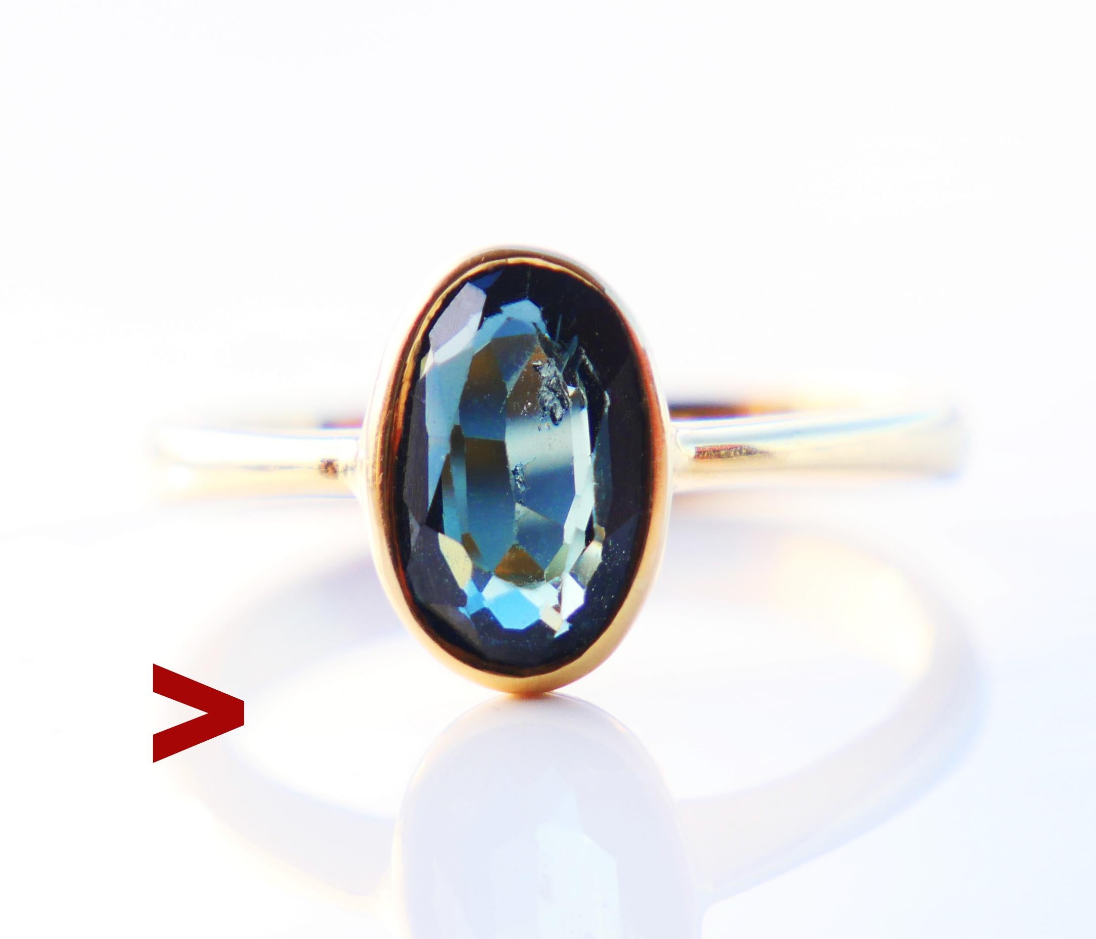 Ring featuring natural oval cut 8 mm x 5.5 mm x 3.25 mm deep / ca. 1.25 ct of Blue color with tint of Green color. Stone demonstrates some internal flaws and seem to change color nuance depending on light conditions. Stone's back is open.

Made in