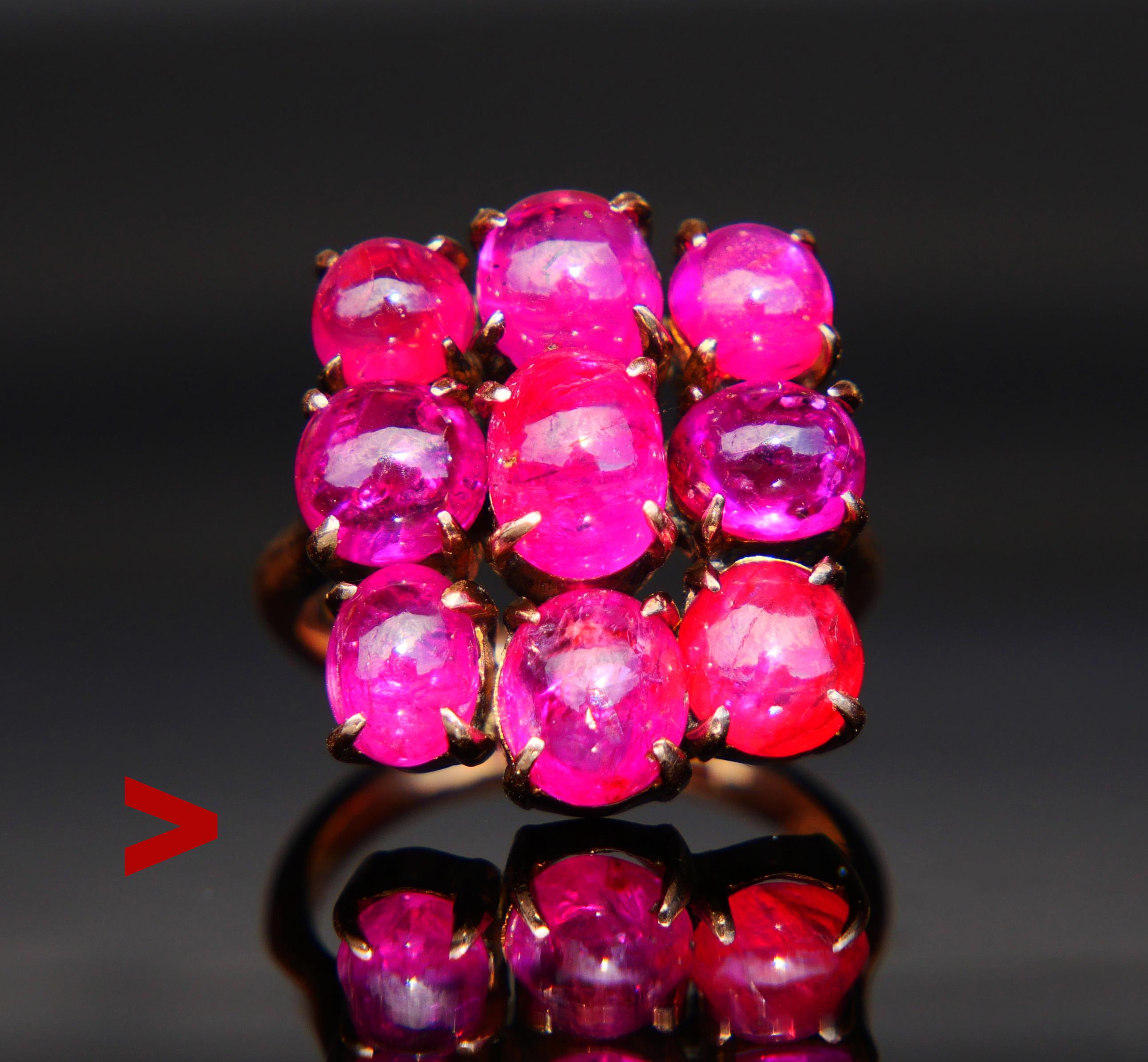 Antique cluster / cocktail Ring, German of Danish made with nine clusters boasting natural Ceylon Rubies cut cabochon.

Total weight of the stones ca 16ctw. Eight stones of similar pinkish Red color ,one stone has more Red than the others. All show