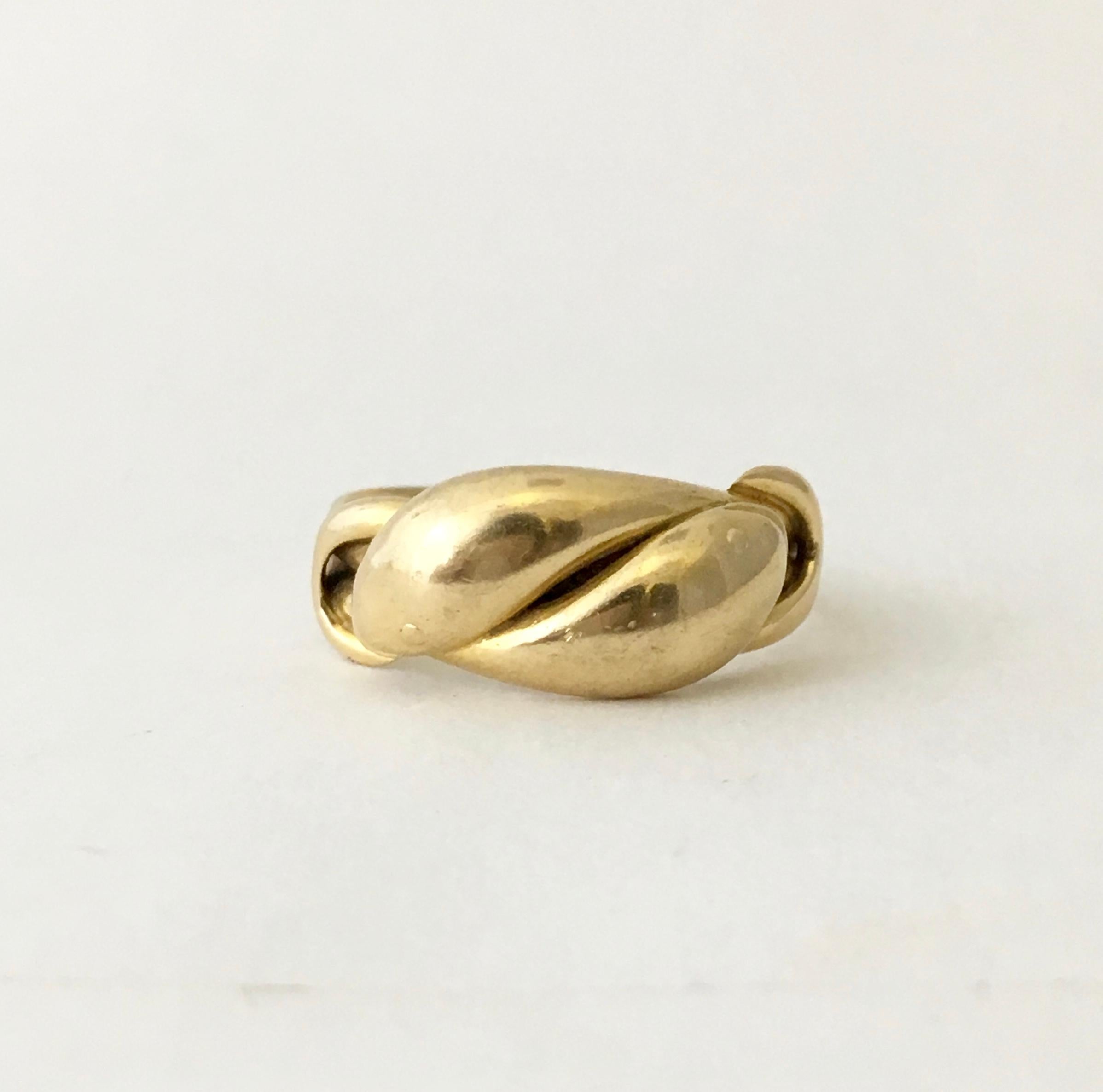 Snakes are revered in many cultures, thought to represent creativity, fertility and transformation. Here, two entwined snakes take the symbolism a step further to create a beautiful love token. 

This stylish 18ct gold ring is a fine example with