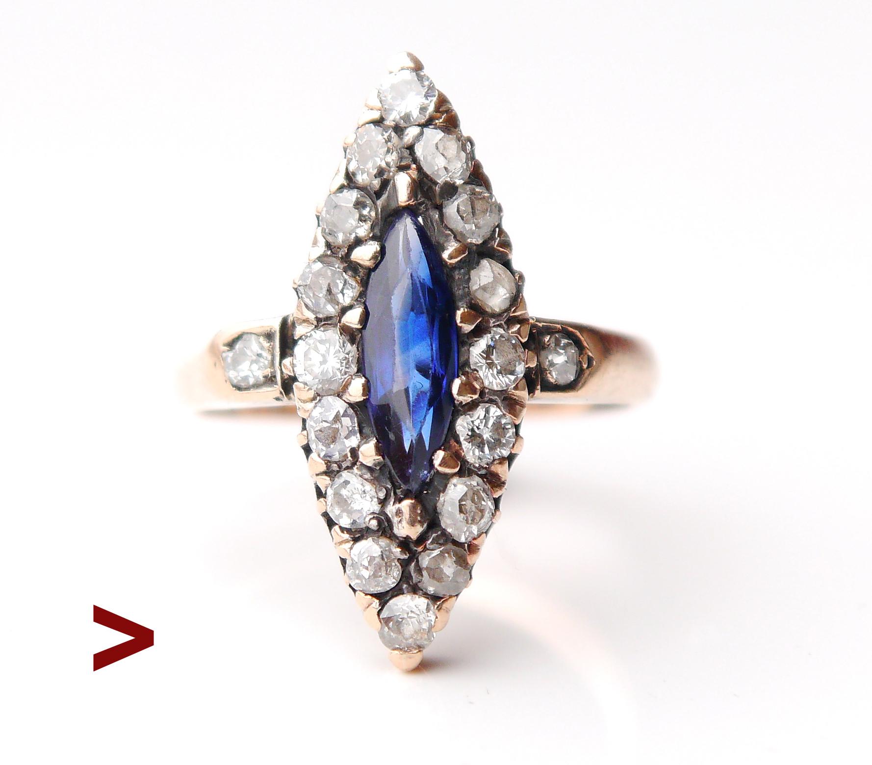 This old ring has a navette or boat-shaped crown with a Silver top on solid 14K Rose Gold set with marquise cut natural Blue Sapphire surrounded with 16 old diamond cut Diamonds on the crown and flanked with 2 more diamonds on the flanks.

XIX -