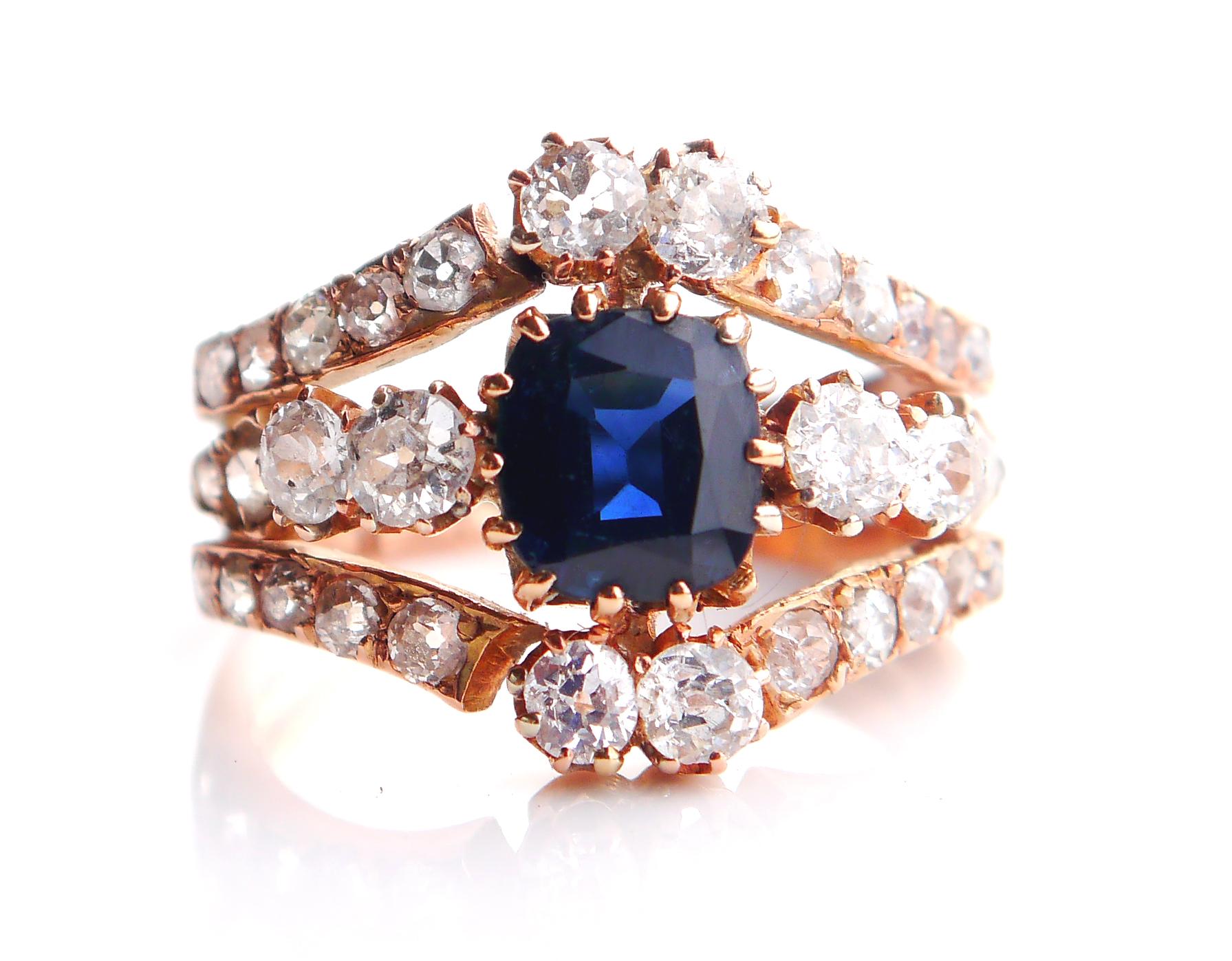 Cluster ring in solid 14K Rose Gold holding three rows of 32 Diamonds and a natural Blue Sapphire.

Made ca. late XIX - early XX cent. The crown side is 15 mm wide in the middle.

Sapphire is of dark Blue color / 7.75 mm x 6.75 mm x 3.7 mm / ca. 2