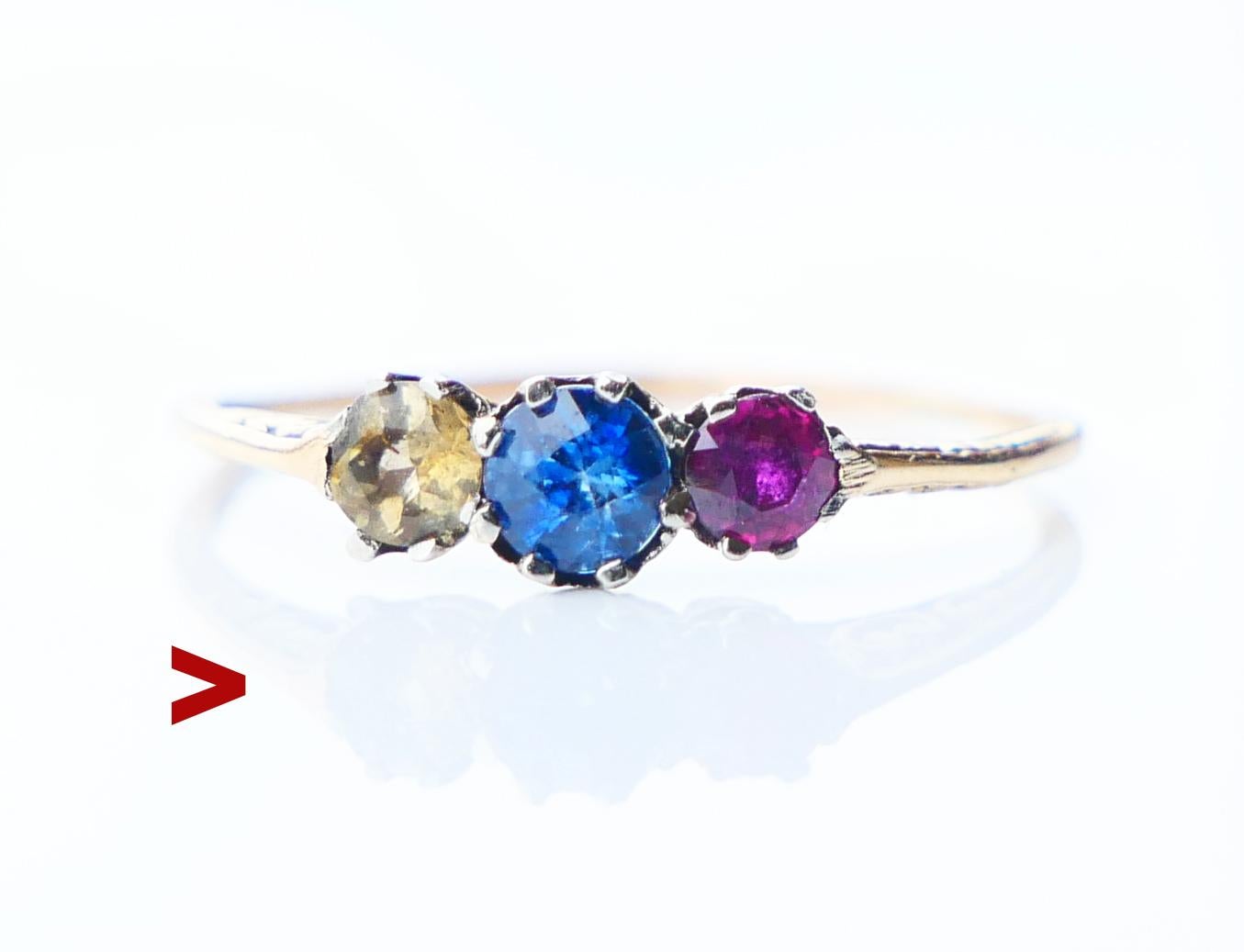 Antique Ring in solid 18K Yellow Gold band with Platinum /or White Gold clusters holding 3 natural old European cut Sapphires. Sapphire in Blue of medium intensity Ø 3.75 mm / ca 0.25 ct with color zoning and inclusions. Yellow and Ruby / or Red