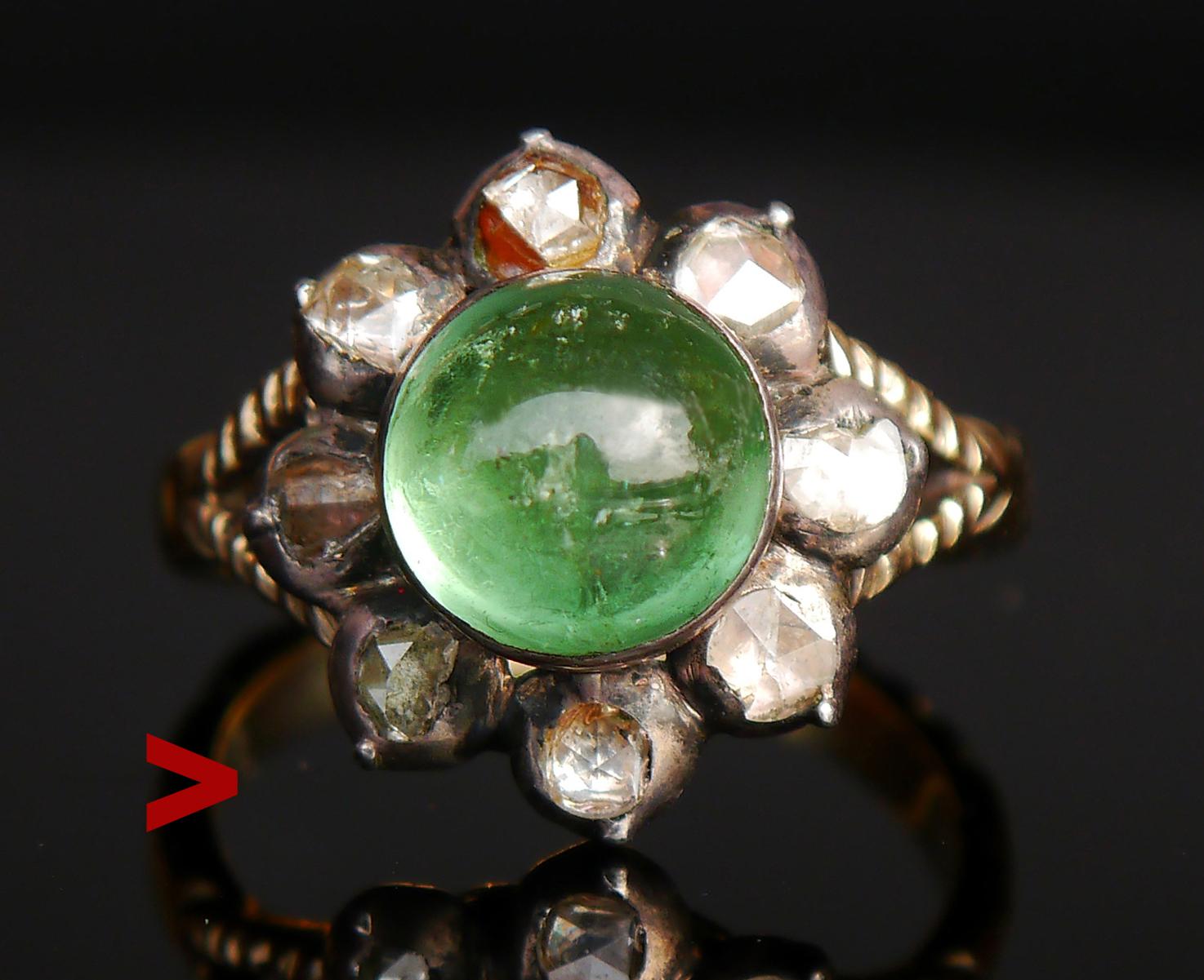 Tourmaline and Diamonds Halo Ring from ca. 1900s -1920s or older. Likely German. 

Carved band in solid 14ct Green Gold (tested) with crown in Silver featuring clusters with natural Green Tourmaline stone Ø 9 mm x 5 mm deep / ca. 3 ct. that looks