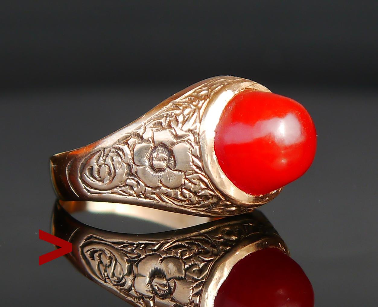 Unusual Antique Ring adorned with bezel set polished Red nipple of natural dark Red Carnelian stone Ø 10 mm x 7.7 mm deep mm / ca. 5 ct. Color of stone may change to lighter or darker depending on light conditions.

Hand engraved or cast floral
