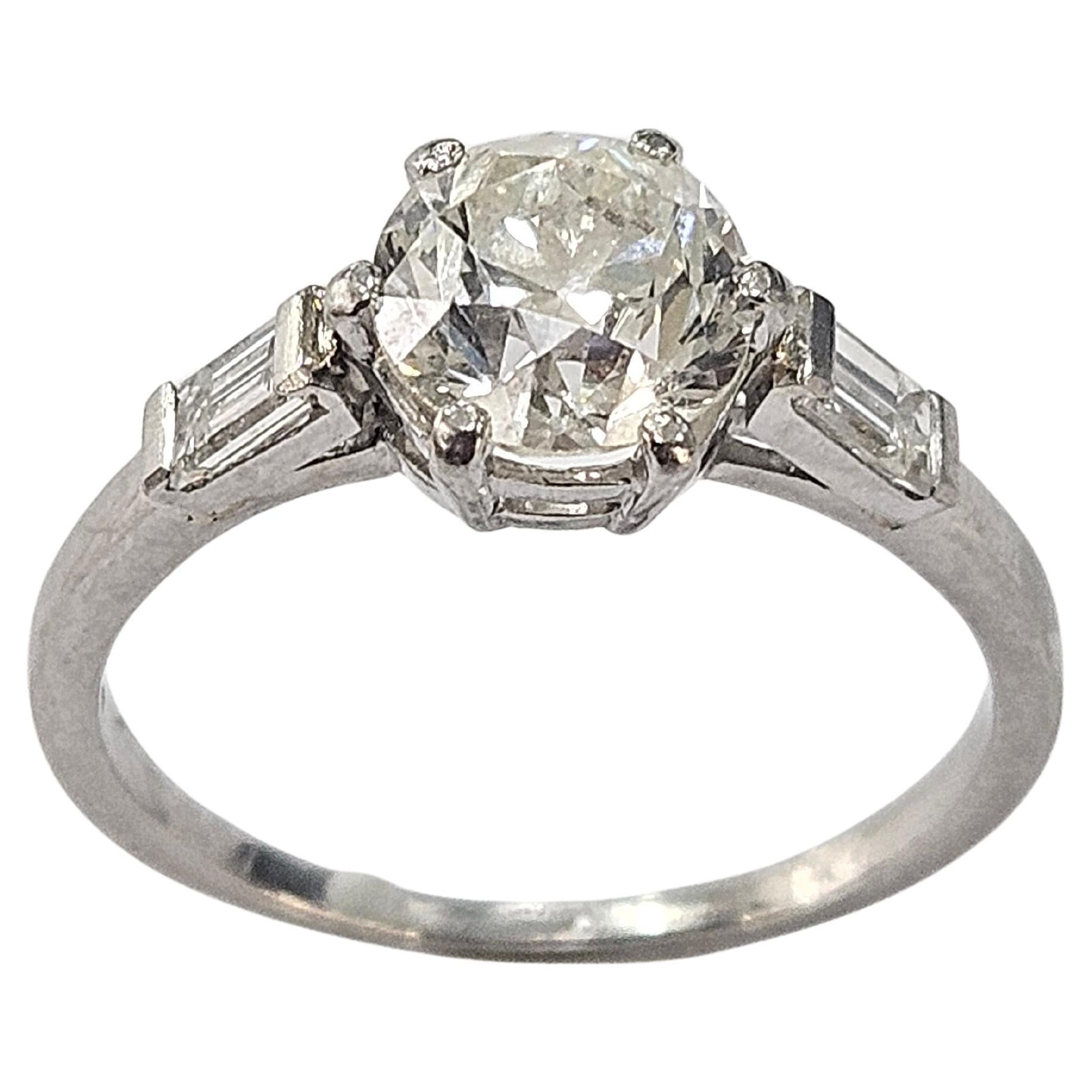 Original antique ring circa 1920 made of platinum 950, with gallery.  Old cut Natural diamond of 1.25 carat (6.55-6.50) x 4.25 millimeters.
H-I Color and SI1 Clarity.
2 Natural diamond Baguette cut each 0.10 cts. (4.20 x 2.10 x 1.20 mm). Ctw.