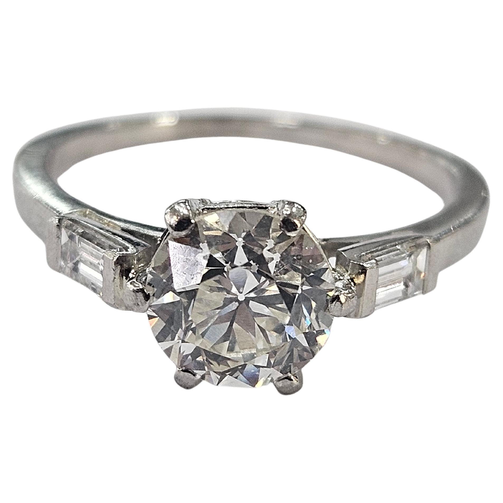 Art Deco Antique Ring  Circa 1920  Old Cut Diamond 1.25 Cwt and two Baguette Platinum 950 For Sale