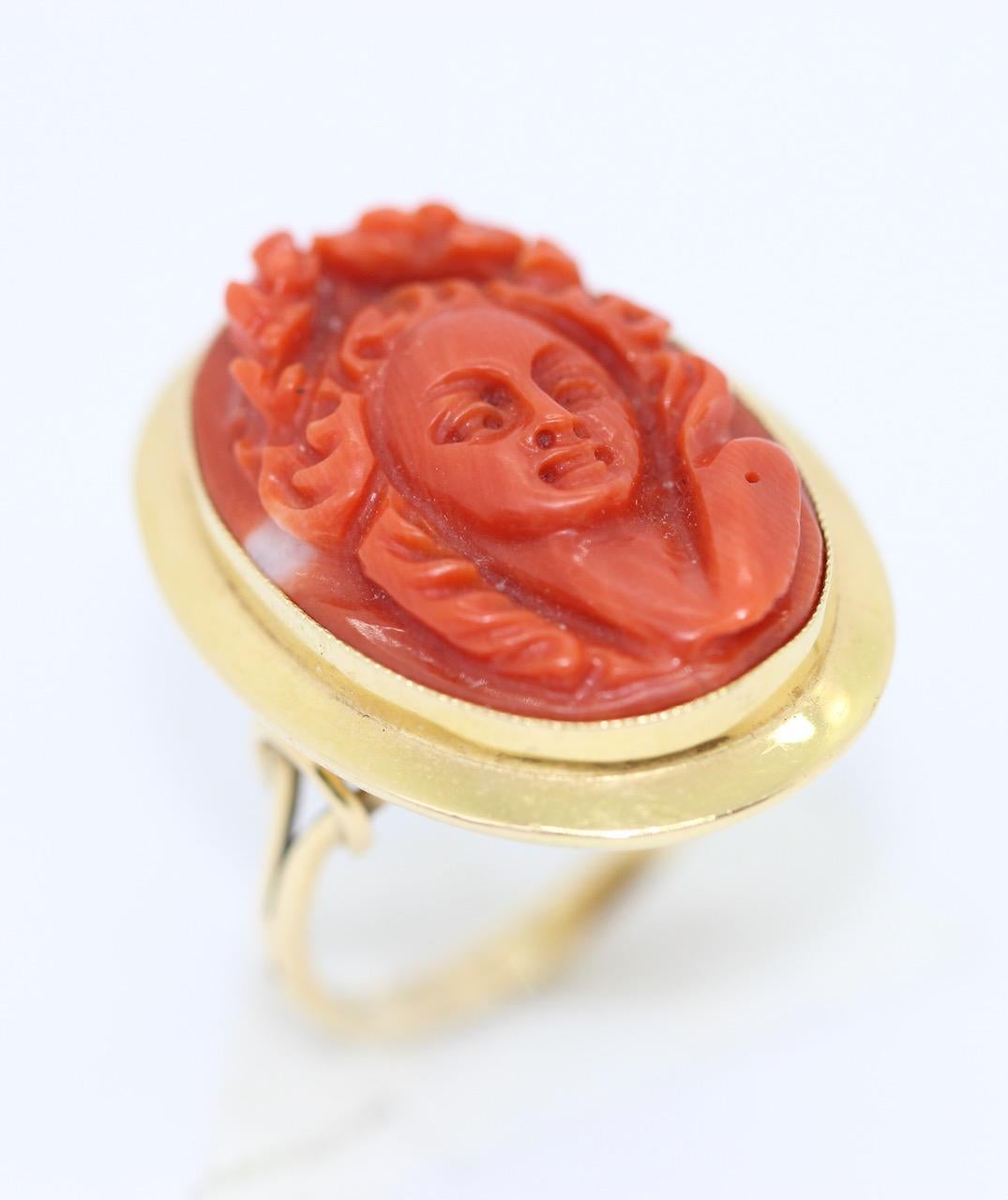 Antique Ring, coral cameo, 18k gold, female portrait

We also have the matching Brooch/Enhancer on offer.

Including certificate of authenticity.